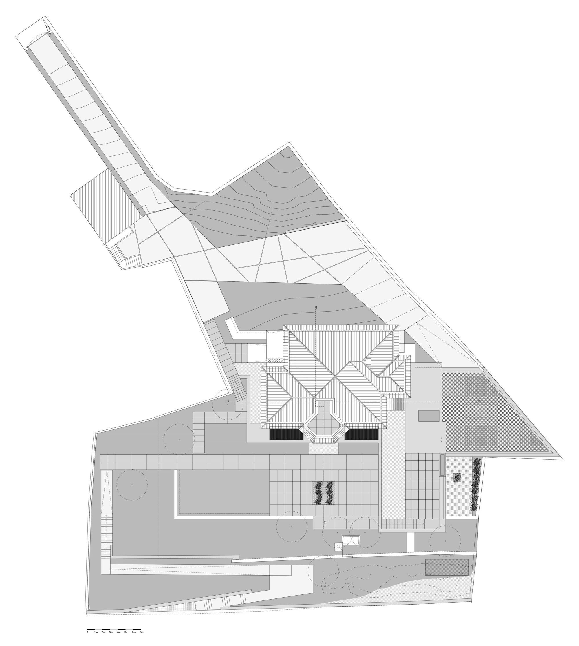 Site plan drawing showing a central building with courtyard, pool, and exterior terraces with plantings
