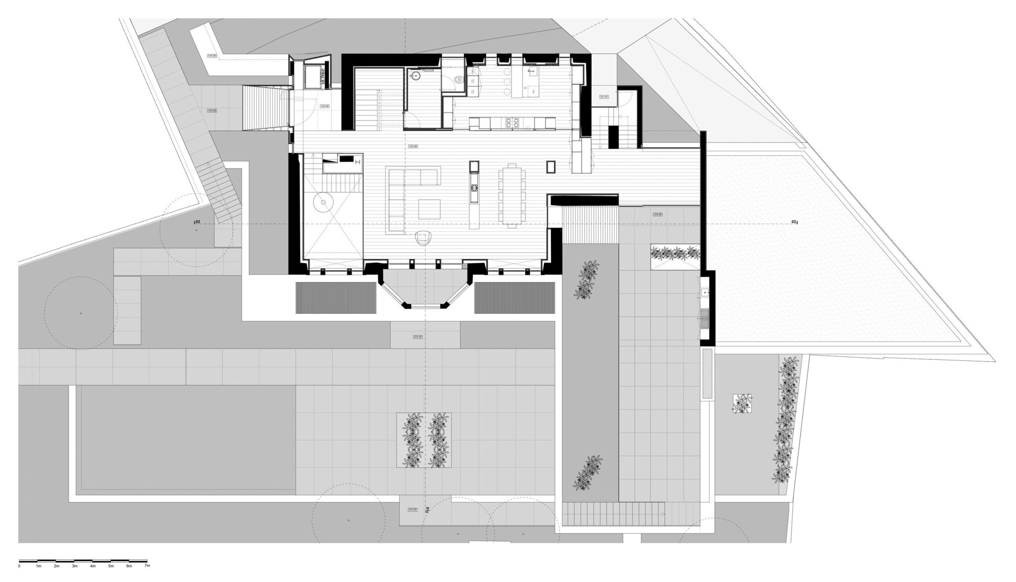 Floor plan drawing showing open living and dining areas with kitchen and exterior courtyard spaces