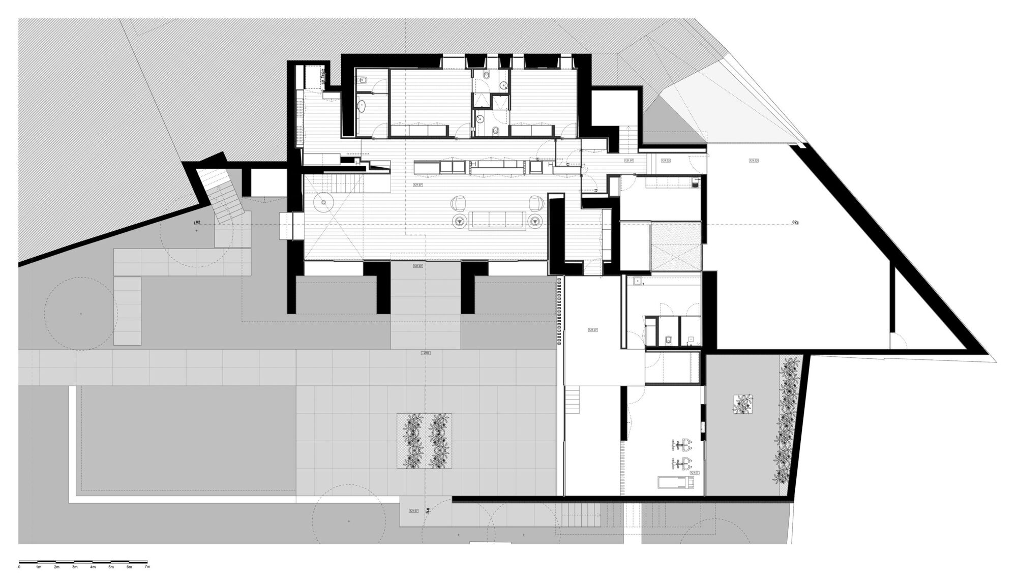 Floor plan drawing showing bedroom wings extending from a central circulation core with terrace access