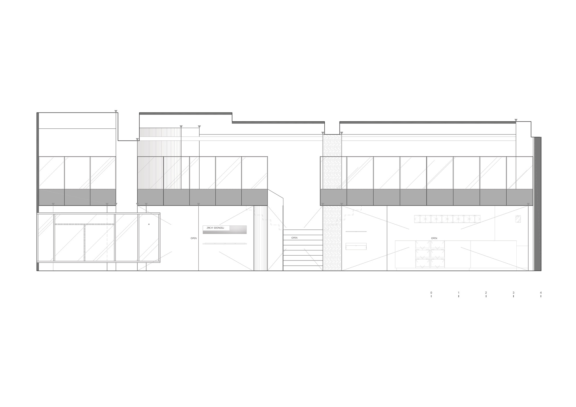 Section drawing showing split-level interiors with a central staircase and built-in shelving units
