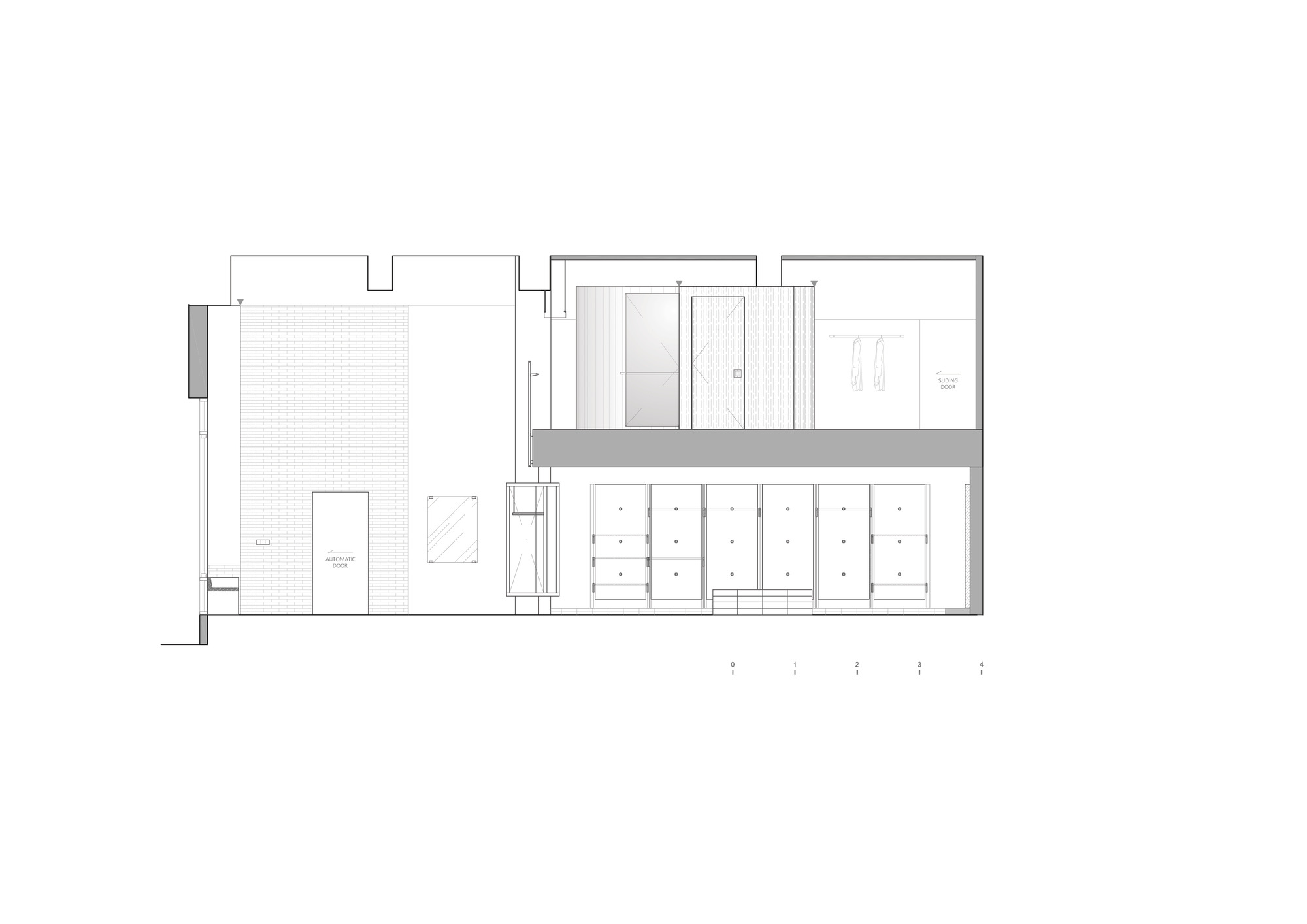 Section drawing showing a narrow vertical circulation core separating spaces with a courtyard on the left