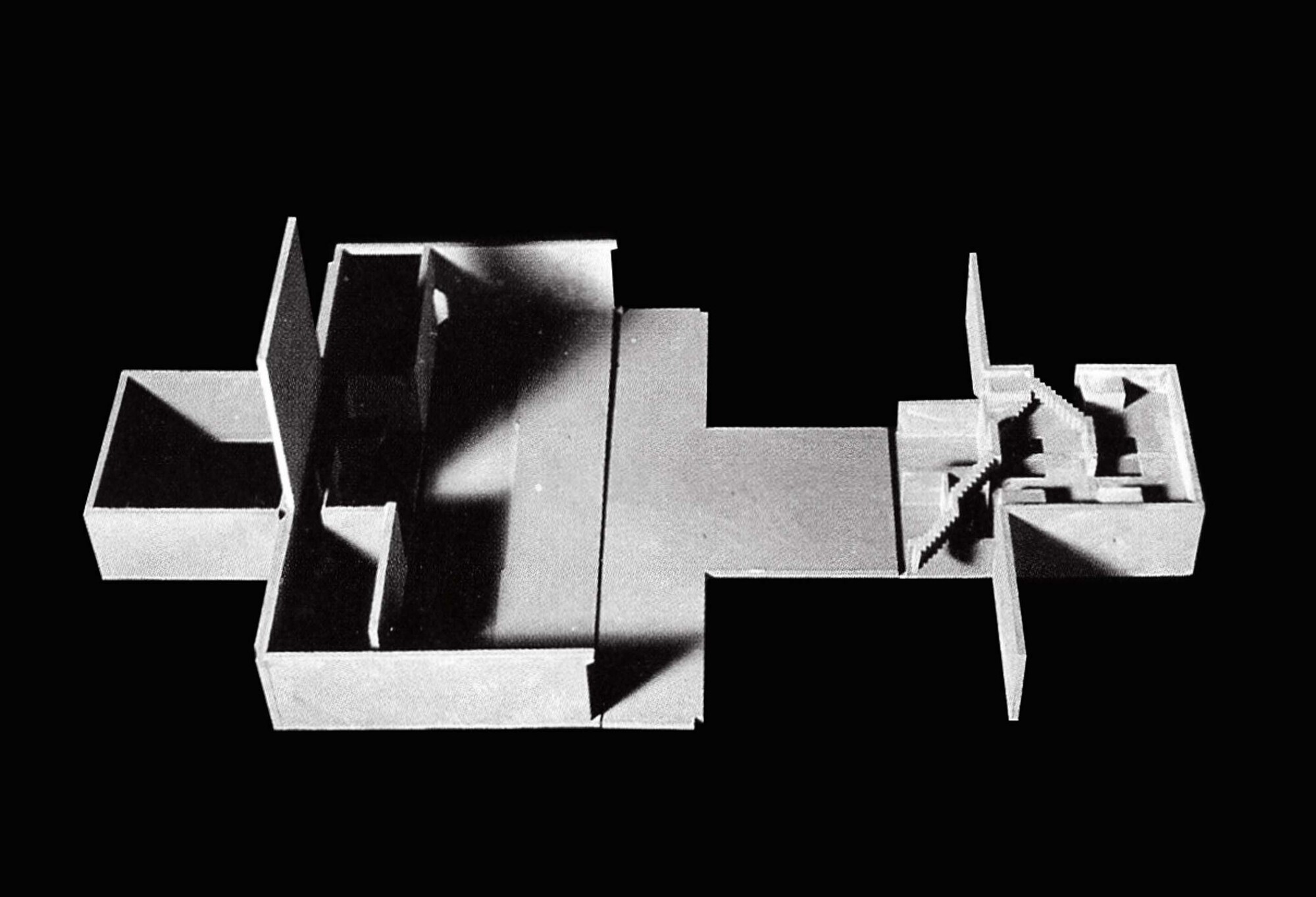 Top-down view of the sectioned physical model revealing interior spatial volumes and walls