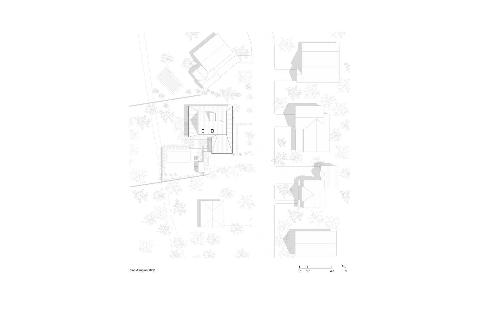 Site plan drawing showing building footprints and surrounding landscape with trees indicated in plan view