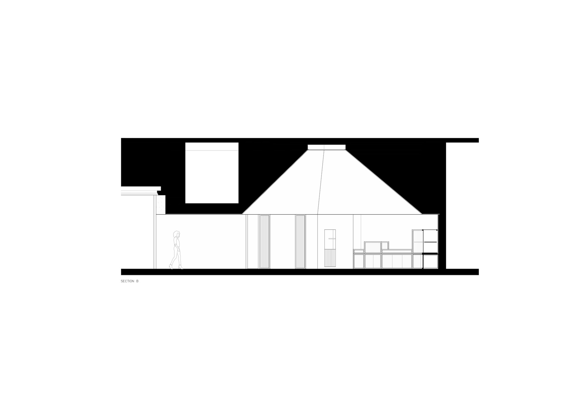 Section drawing showing a double-height interior space beneath a tall pyramidal roof with figure for scale