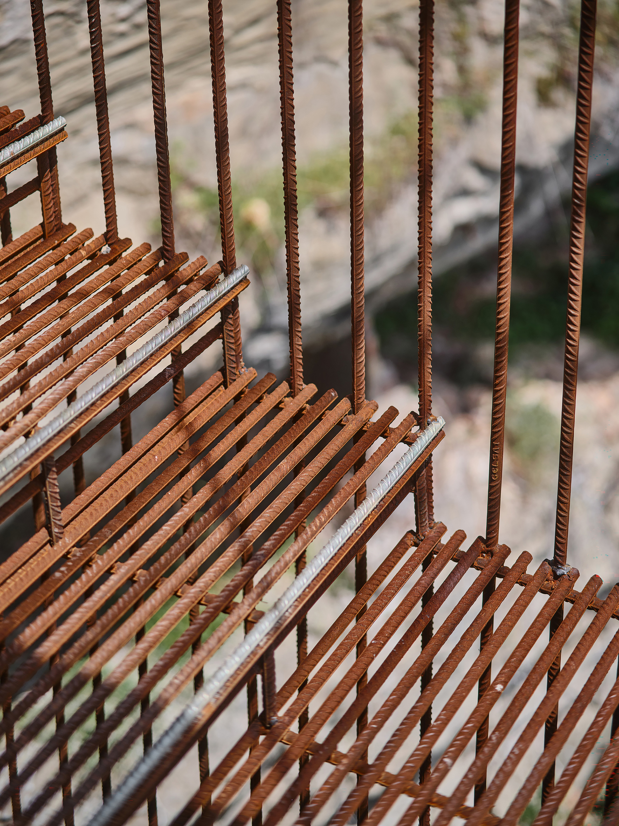 Layered rebar steps with vertical rods penetrating horizontal slat treads