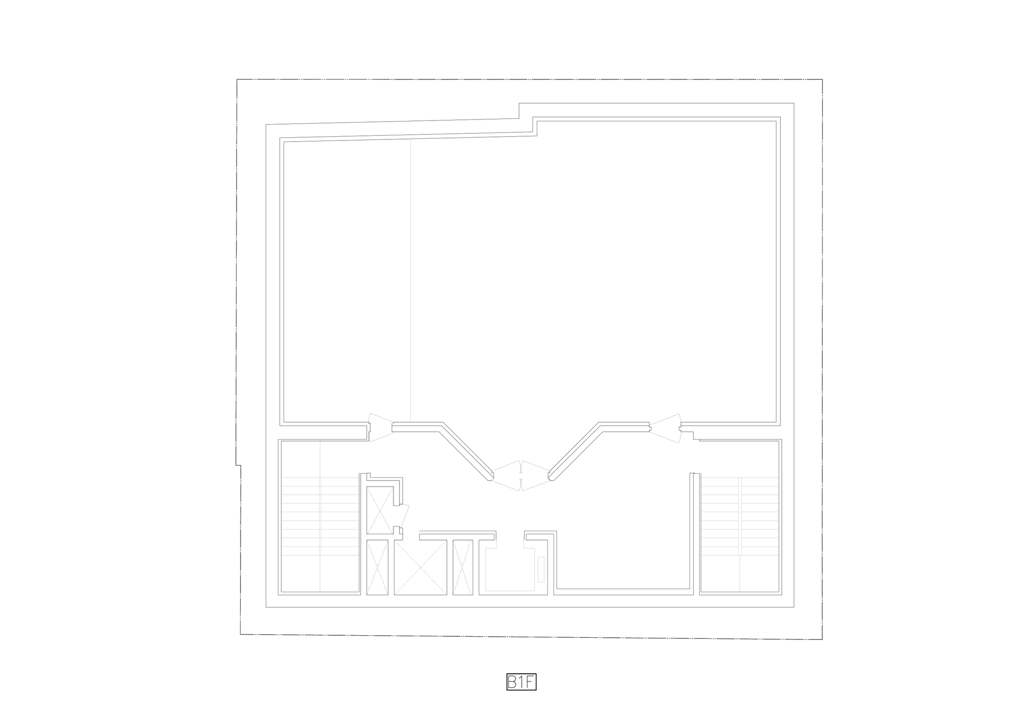 Floor plan drawing showing a large open room with two staircases and central service spaces below