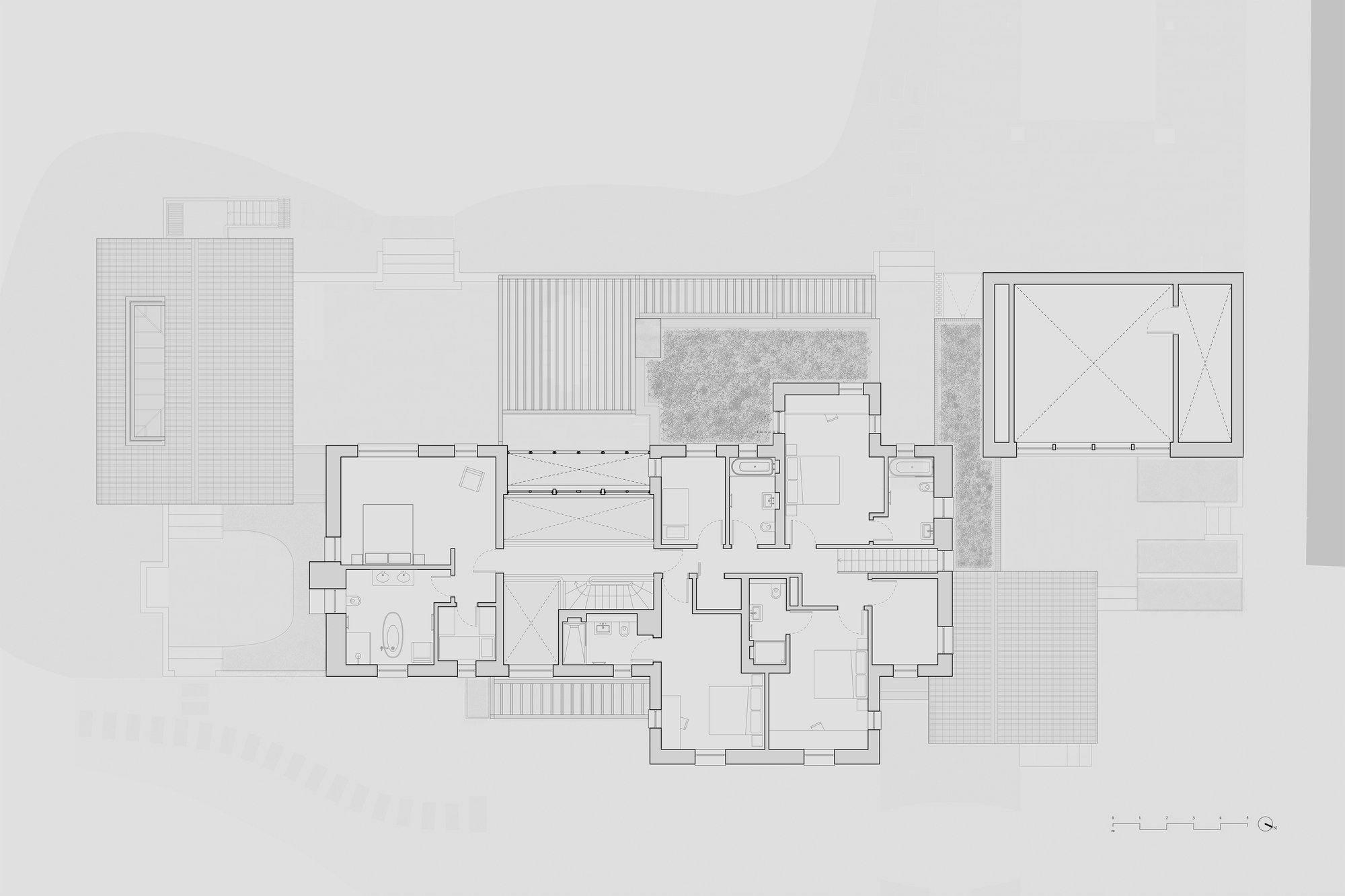 Floor plan drawing showing interconnected rectangular volumes with courtyards and patterned stone areas