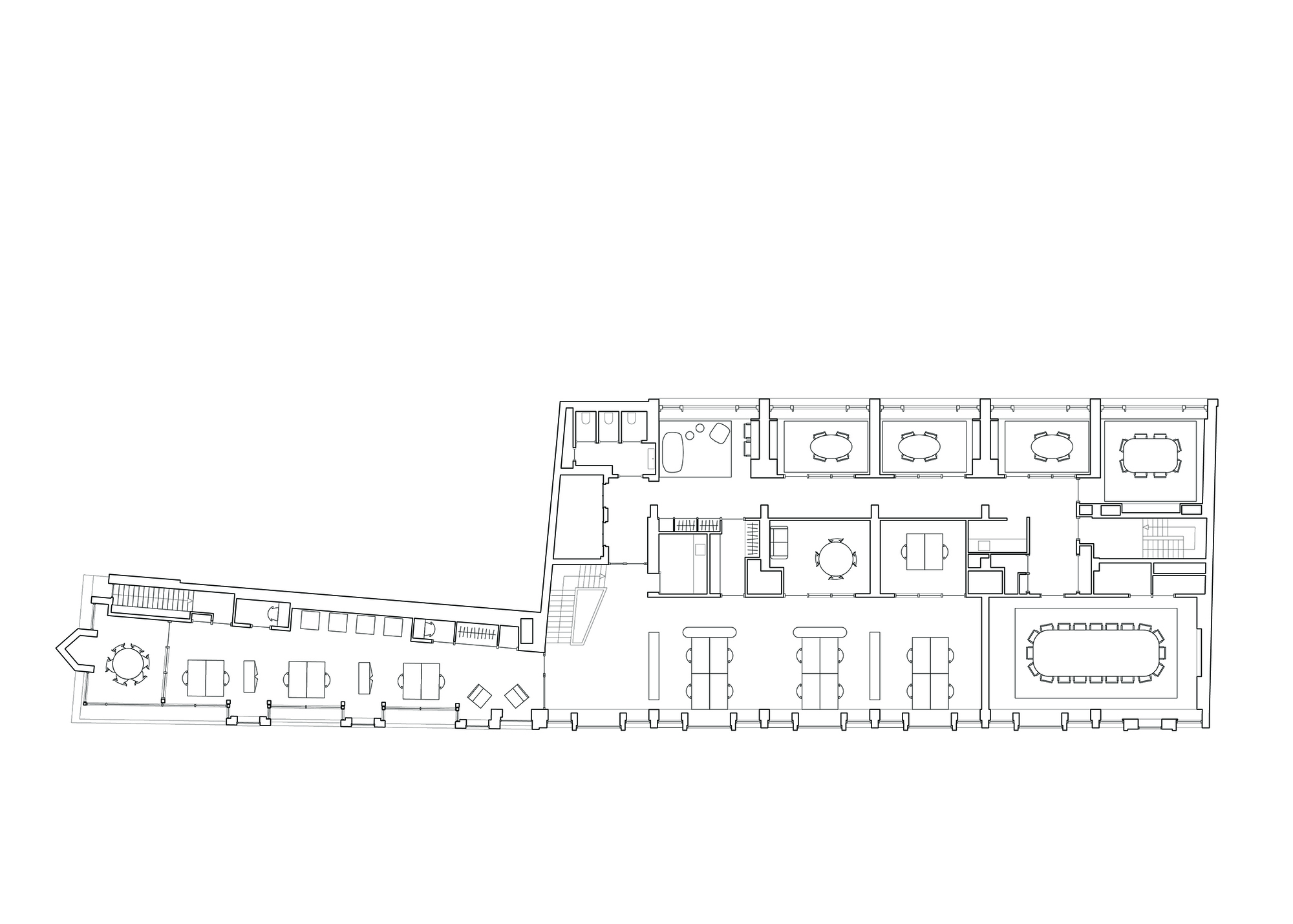 Floor plan drawing showing office spaces with conference rooms and furniture layouts