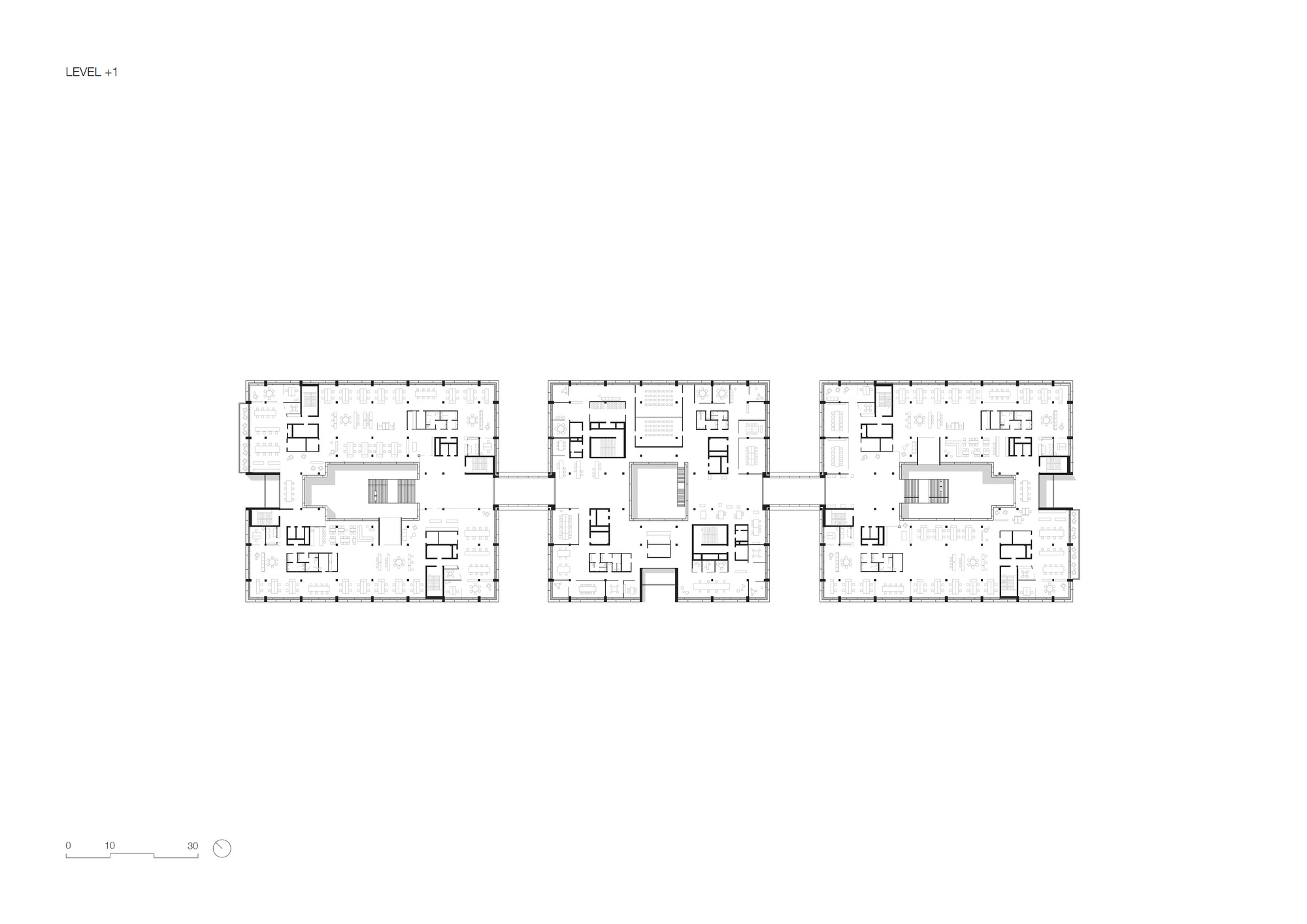 Floor plan drawing of three connected rectangular volumes with central cores and open floor areas