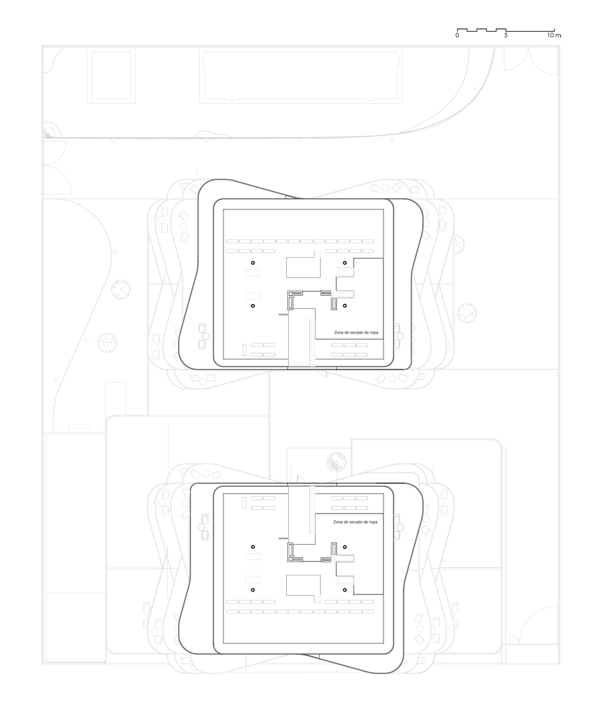 Floor plan drawings showing two basement levels with parking and service zones within rounded building footprints