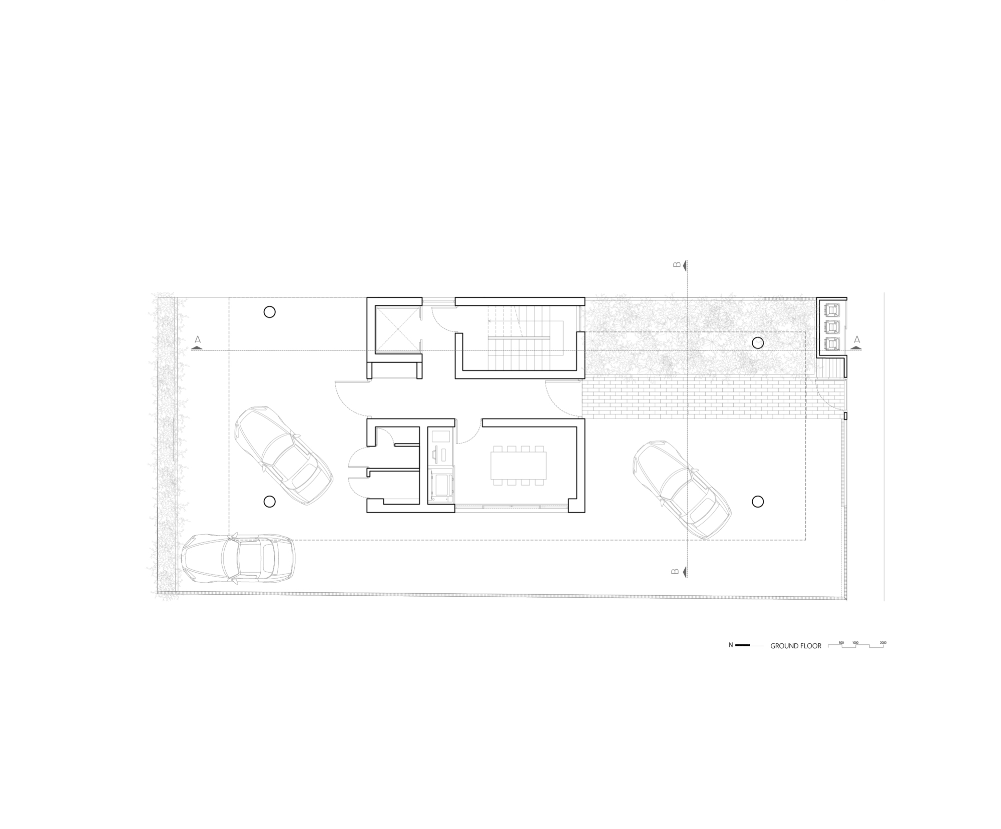 Ground floor plan drawing showing two parking bays, central stair, and paved courtyard