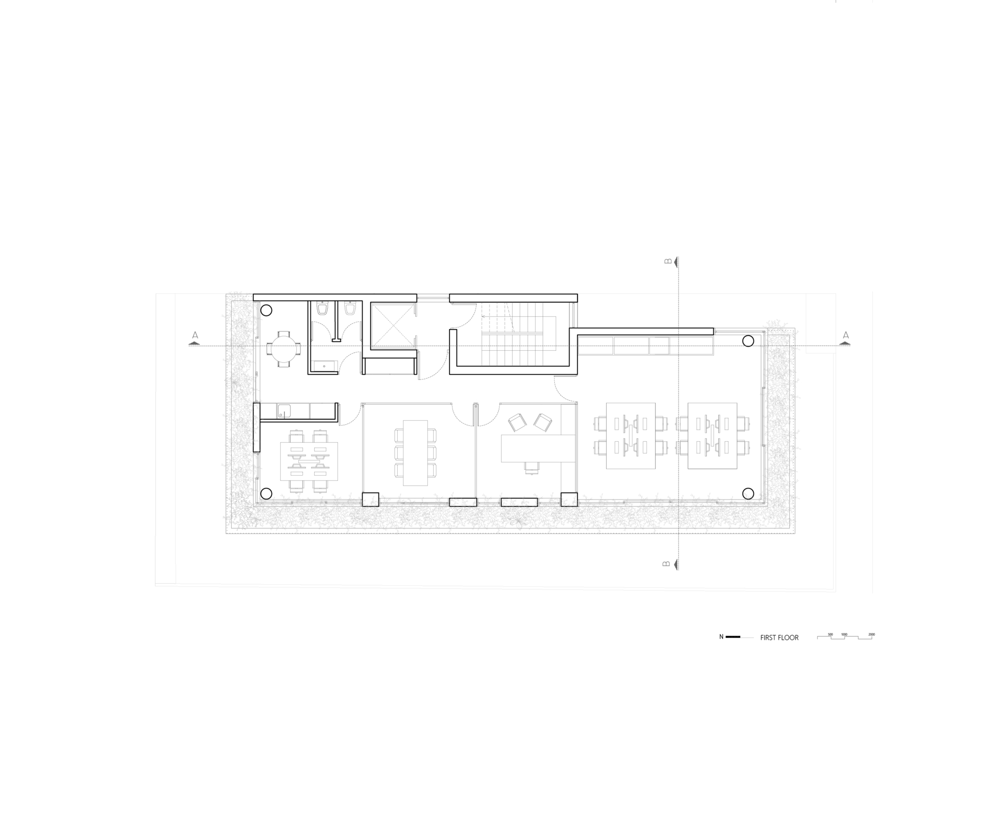 First floor plan drawing showing a rectangular layout with pool, open dining and living areas
