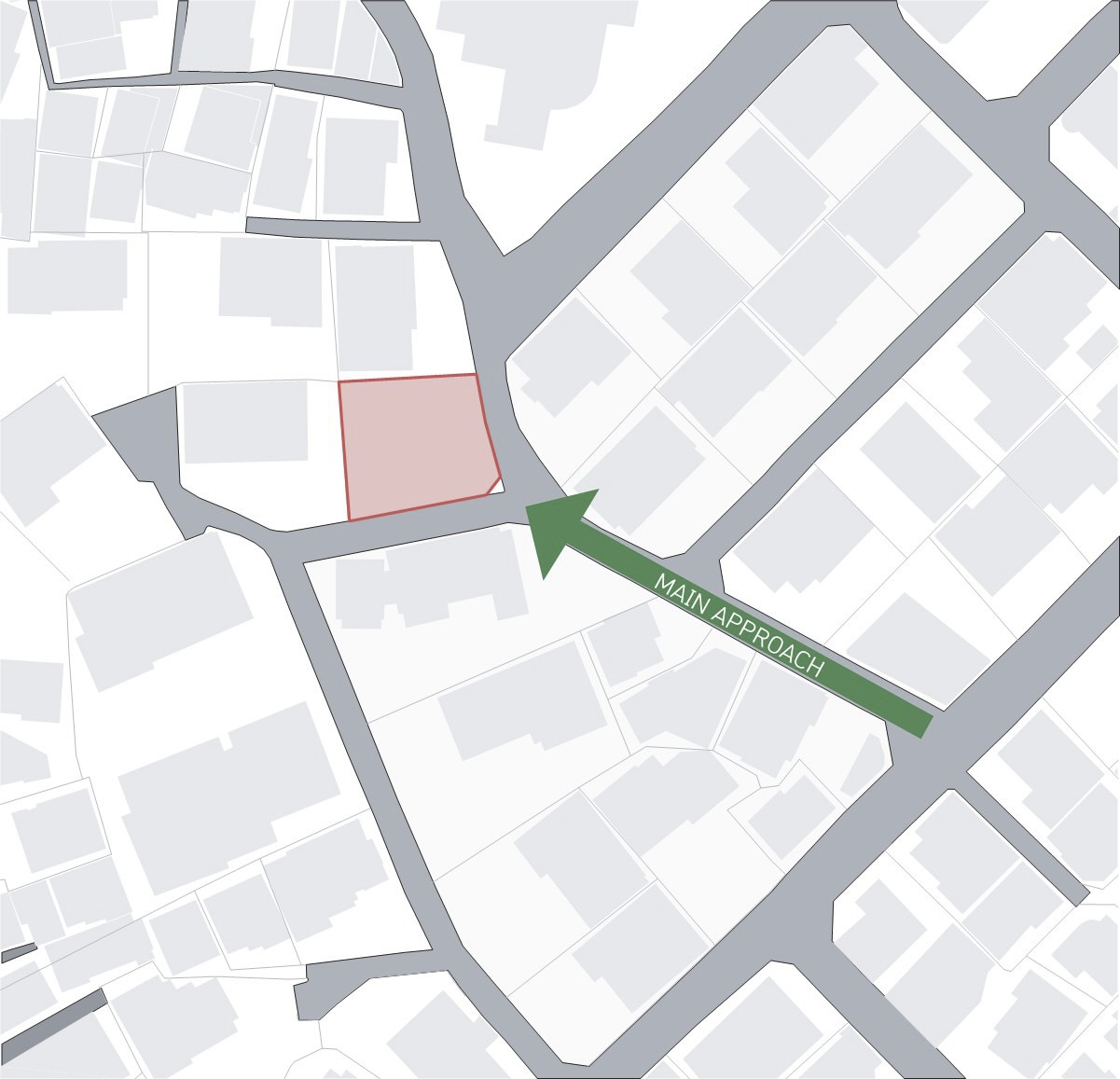 Site plan diagram showing the building footprint in pink and main approach arrow in green