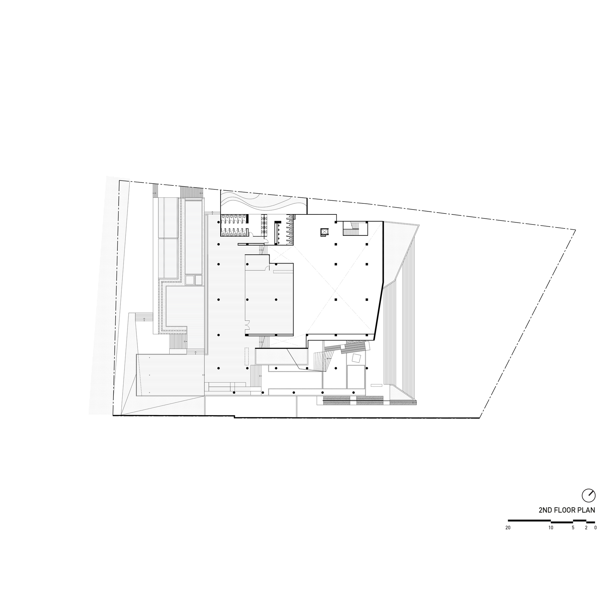 Second floor plan drawing showing open gallery spaces and service cores within trapezoid footprint