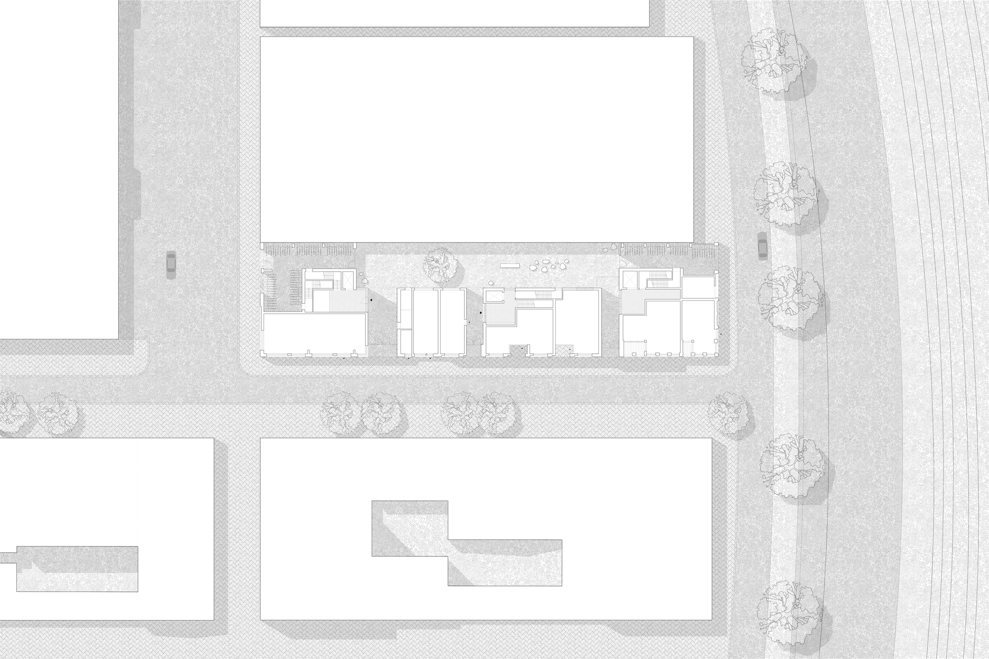 Site plan drawing showing building footprint with courtyard and row of street trees