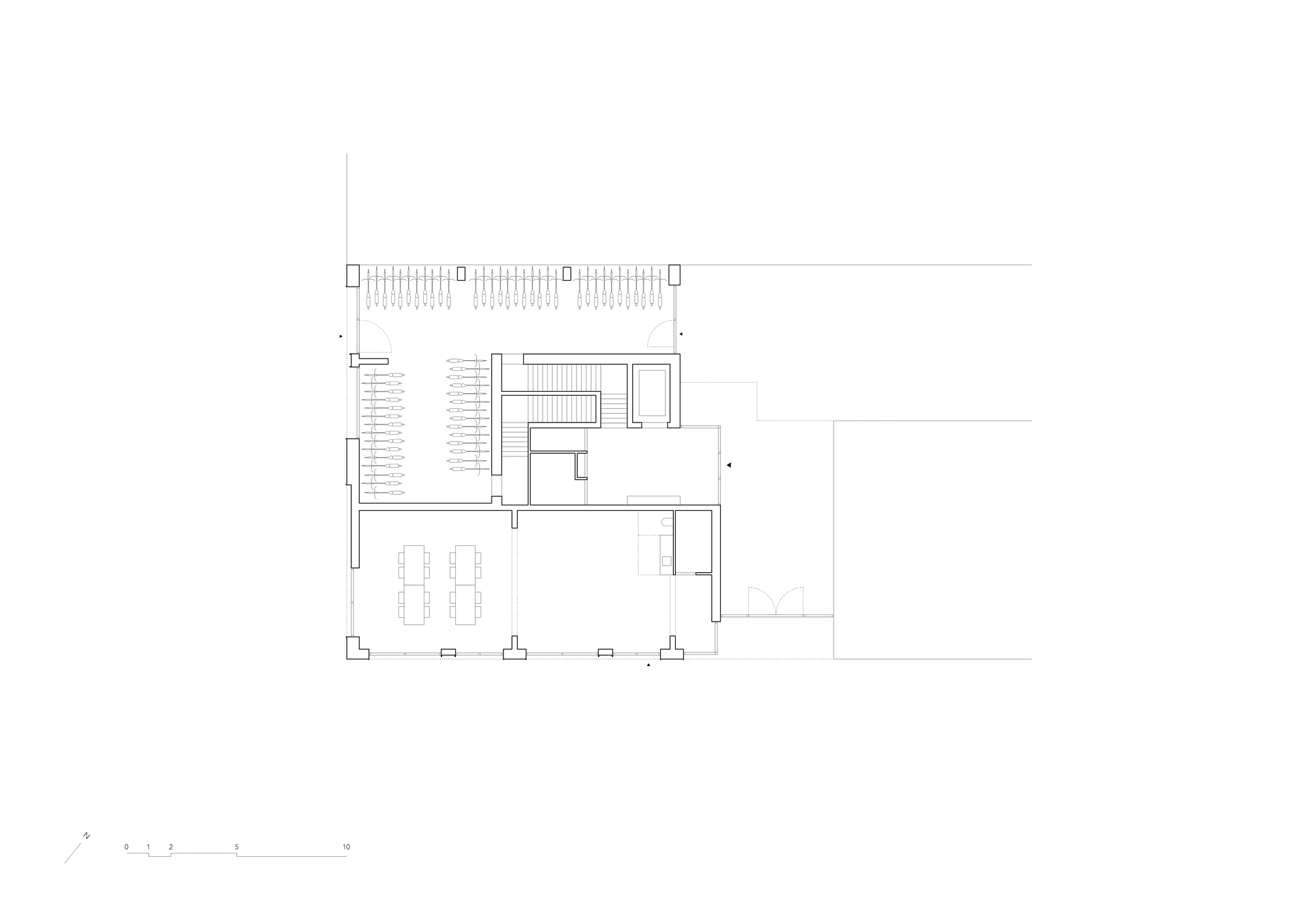Ground floor plan drawing showing parking area, stairwell, and open dining space with terrace