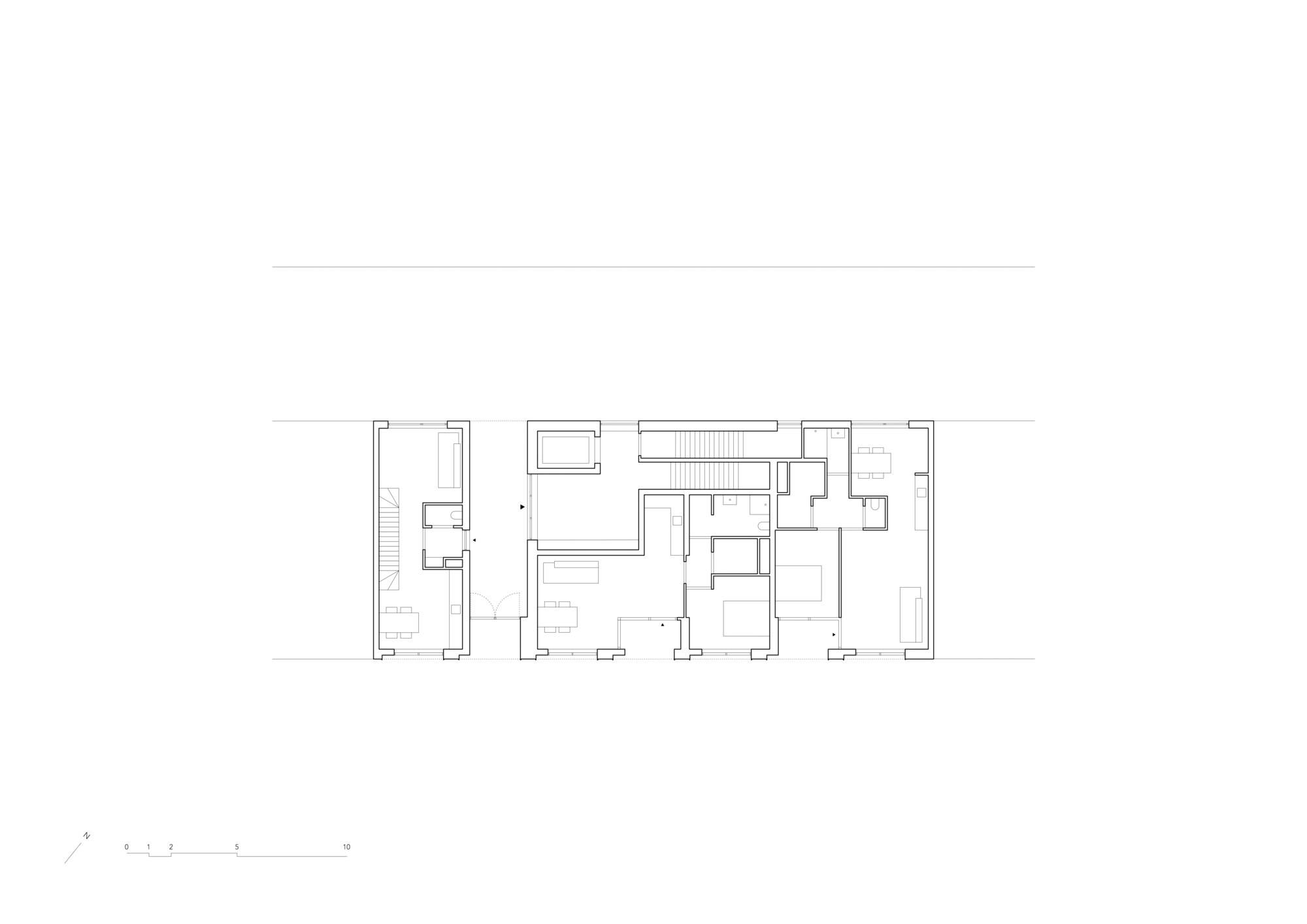 Floor plan drawing showing staggered residential units connected by a central circulation spine