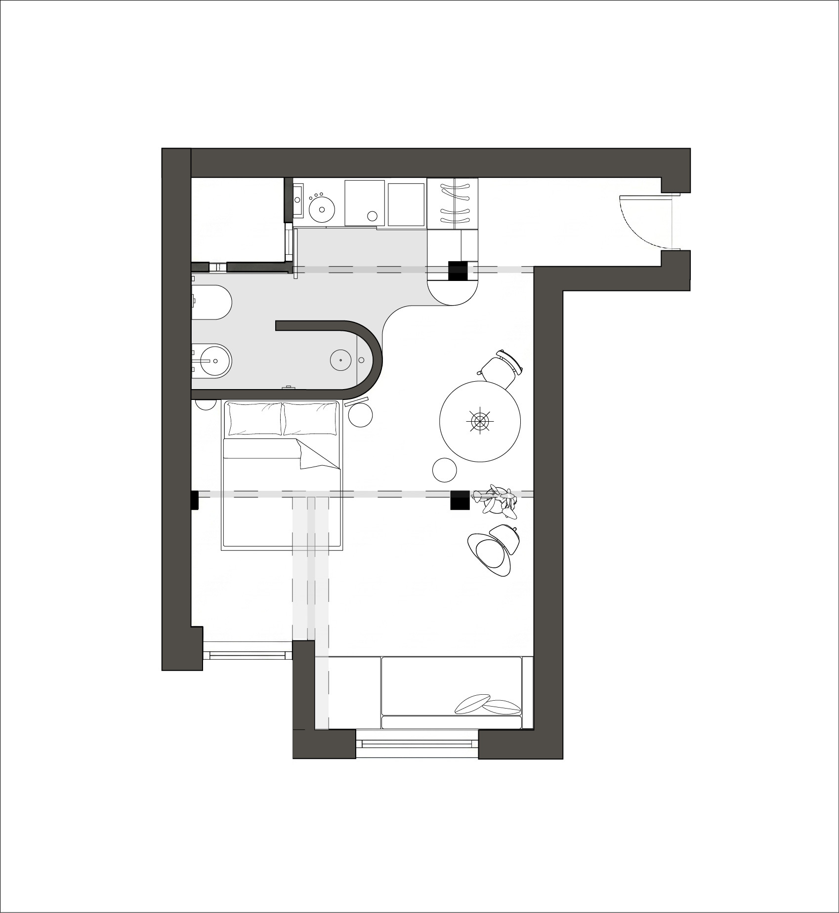 Floor plan showing a compact apartment with bedroom, bathroom, kitchen and living area