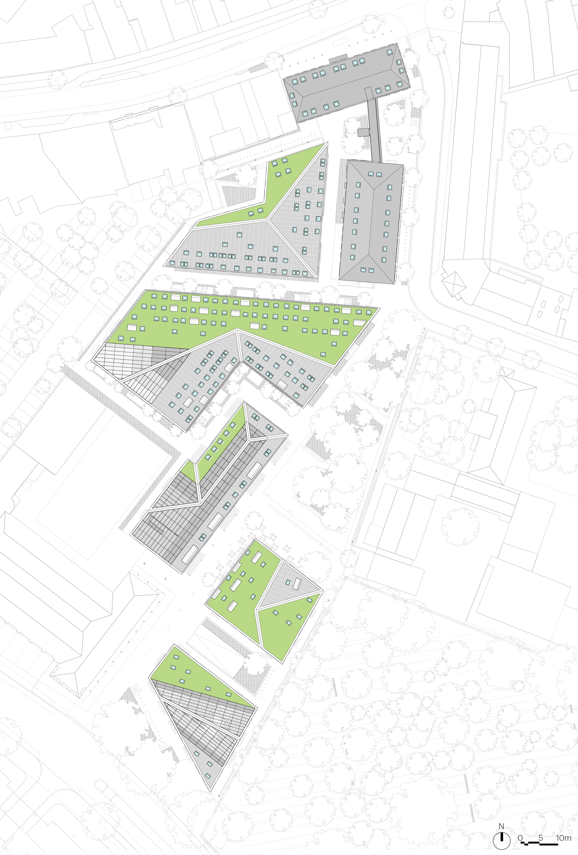 Site plan drawing with green roof areas highlighted across multiple building volumes