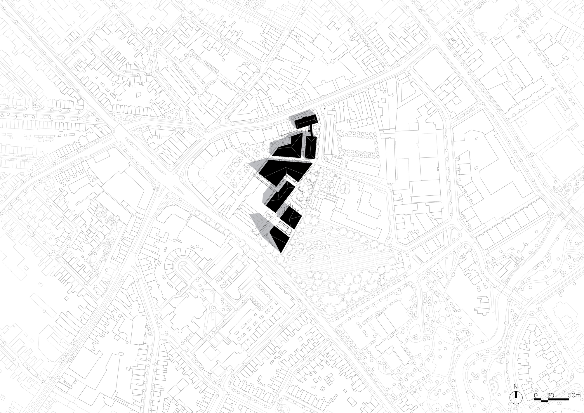 Site plan drawing displaying black building footprints set within a dense network of surrounding urban blocks