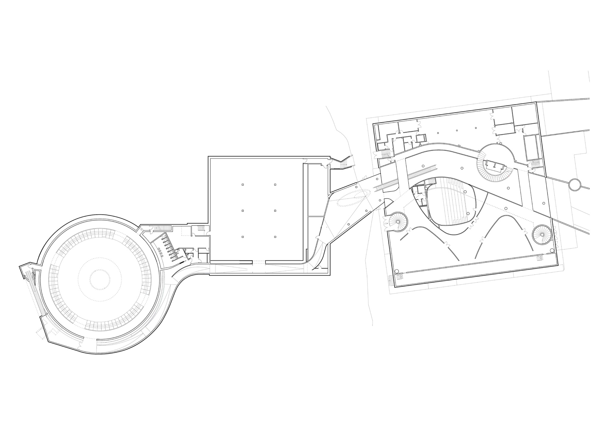 Floor plan drawing showing circular theater volume connected to rectangular gallery spaces and landscaped exterior courts