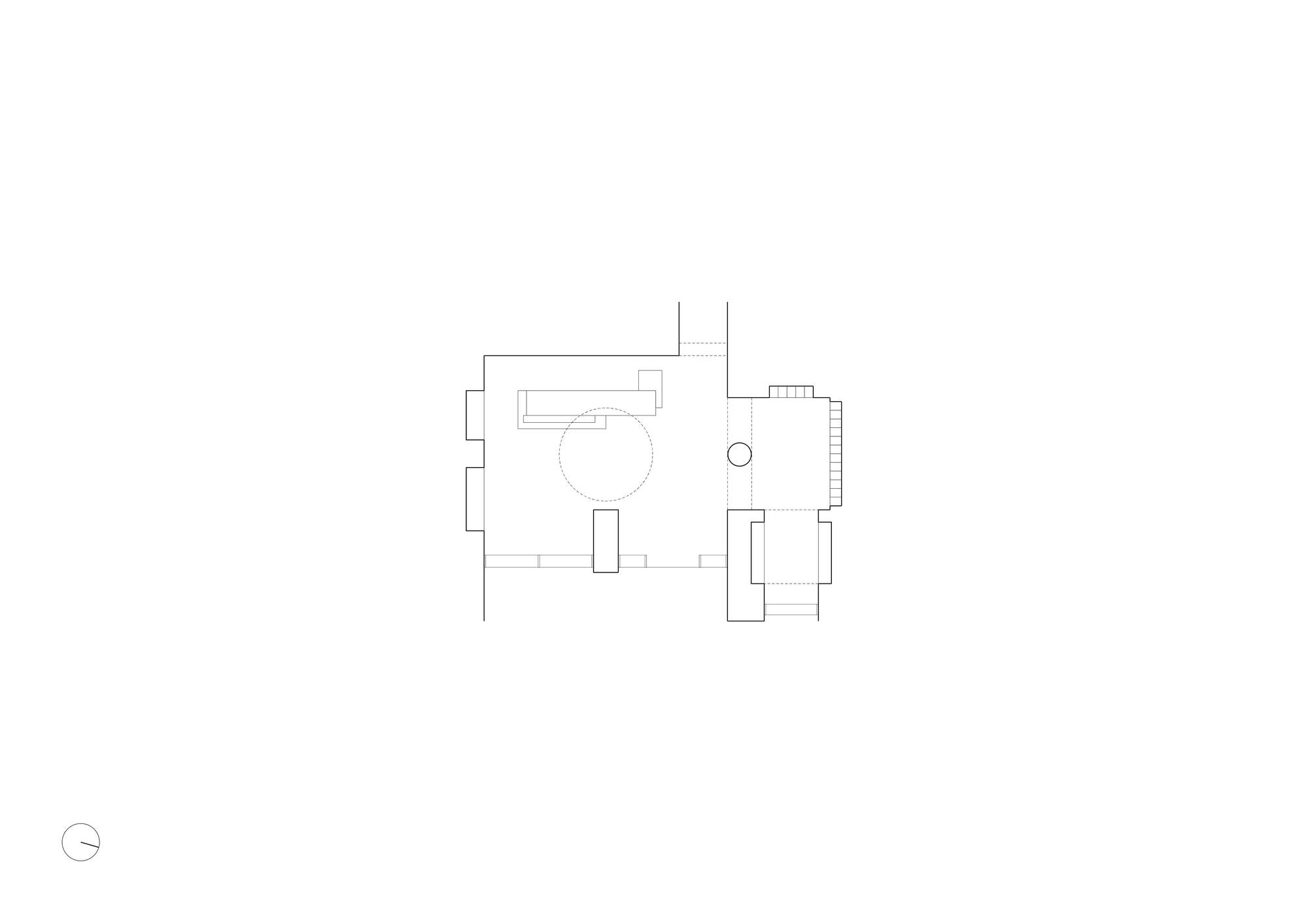 Floor plan drawing showing two connected rooms with circular element and north arrow indicator