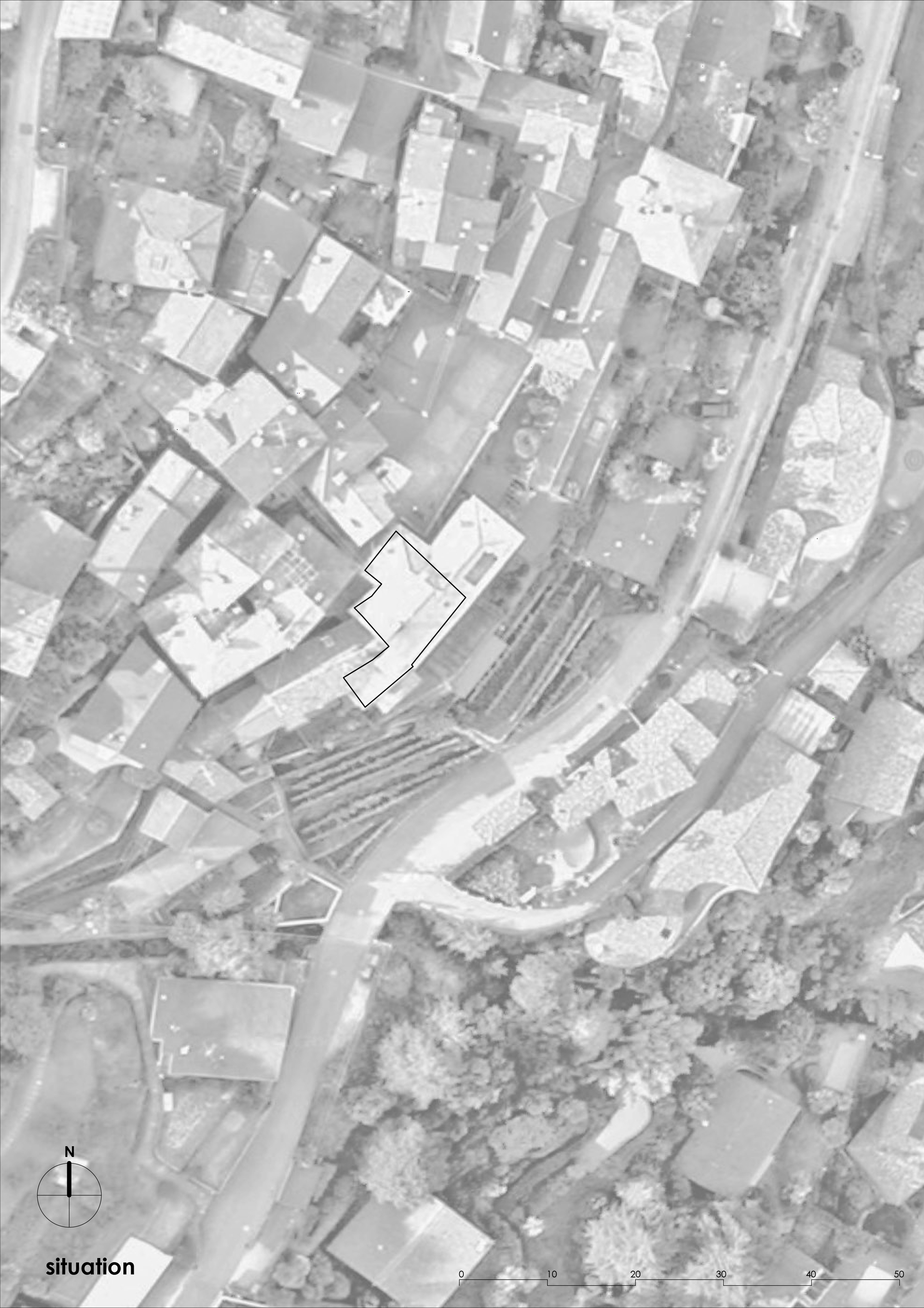 Site plan drawing showing a building footprint outlined among residential structures and dense tree cover