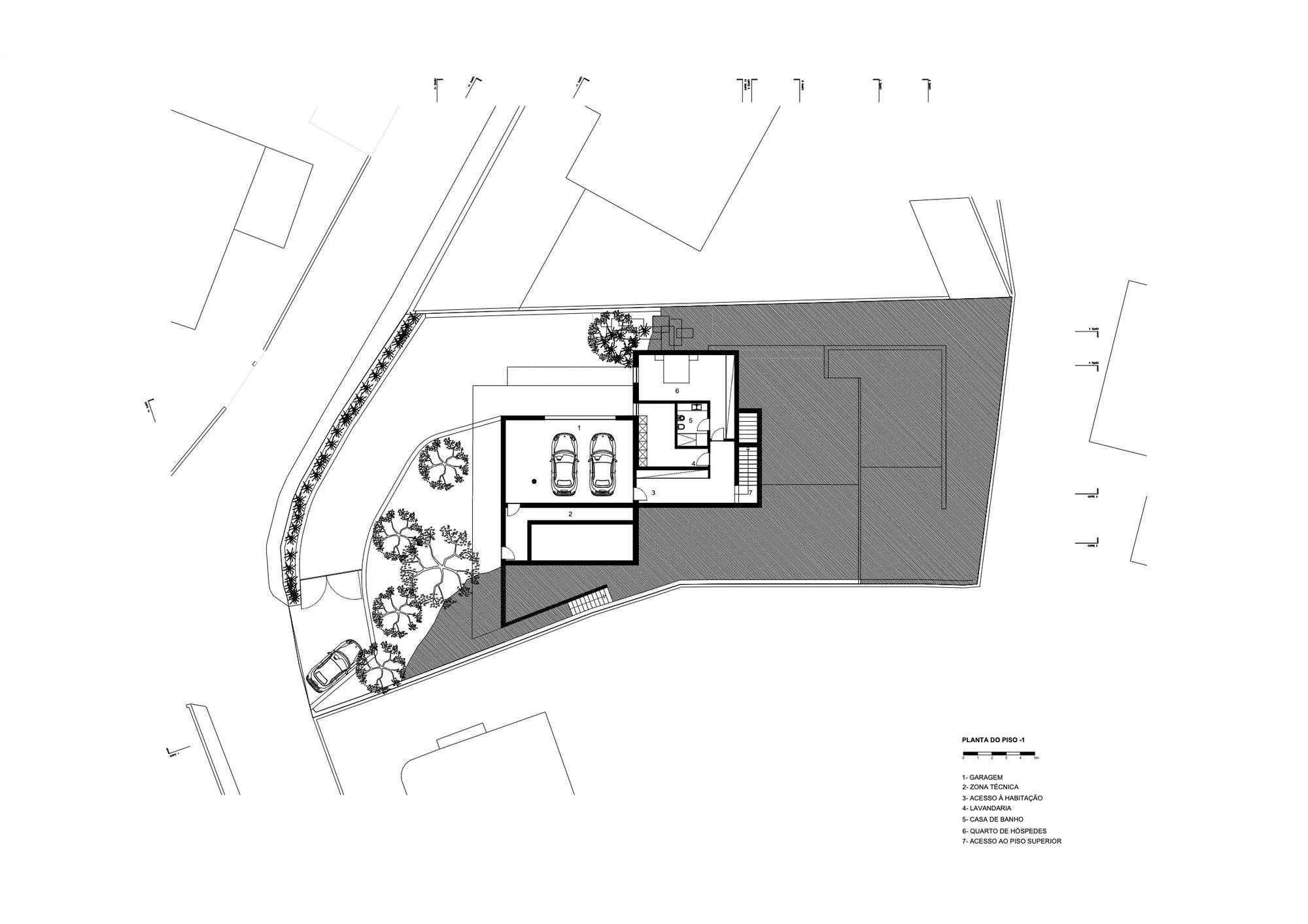 Site plan drawing showing the building footprint on a sloped lot with landscaping