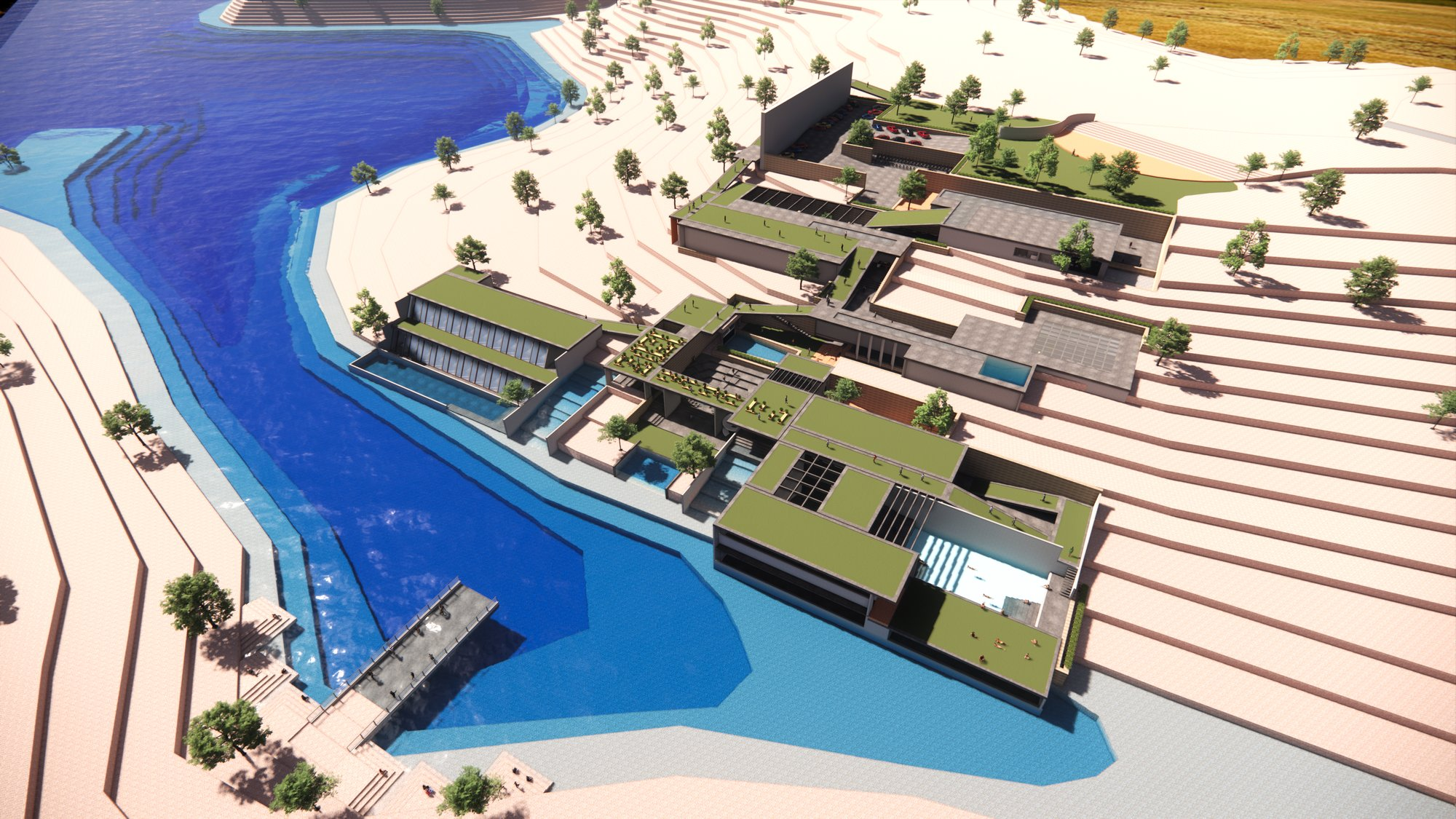 Aerial view of the terrain-integrated complex connecting green roofs, water spaces, and the lake edge.
