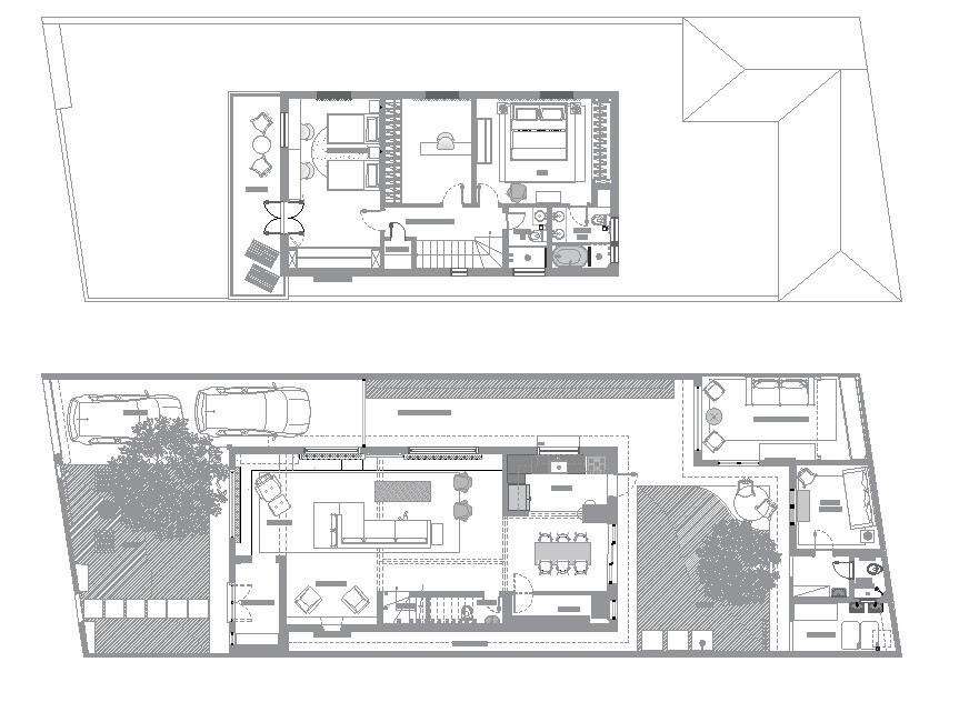 Two-level floor plan drawing showing split-level living spaces with central courtyard voids and rooftop volumes
