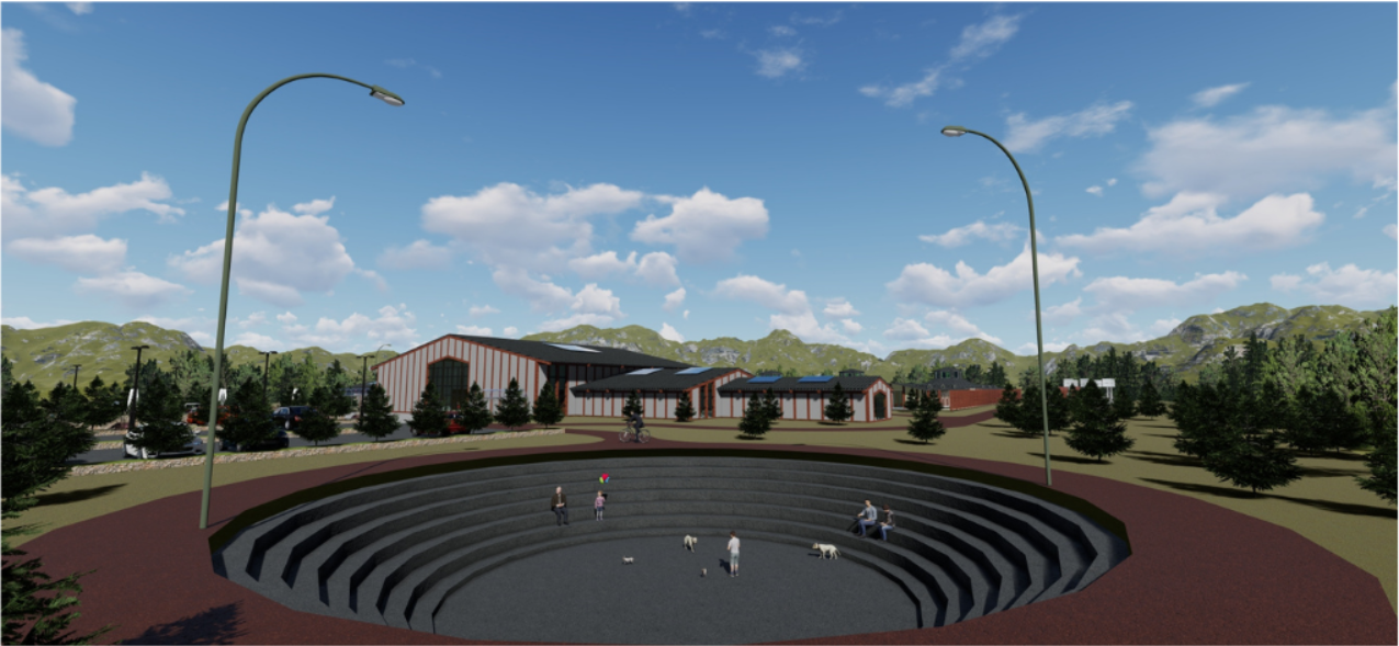 Circular amphitheater with concentric terraced seating tiers set into the landscape before low-rise buildings
