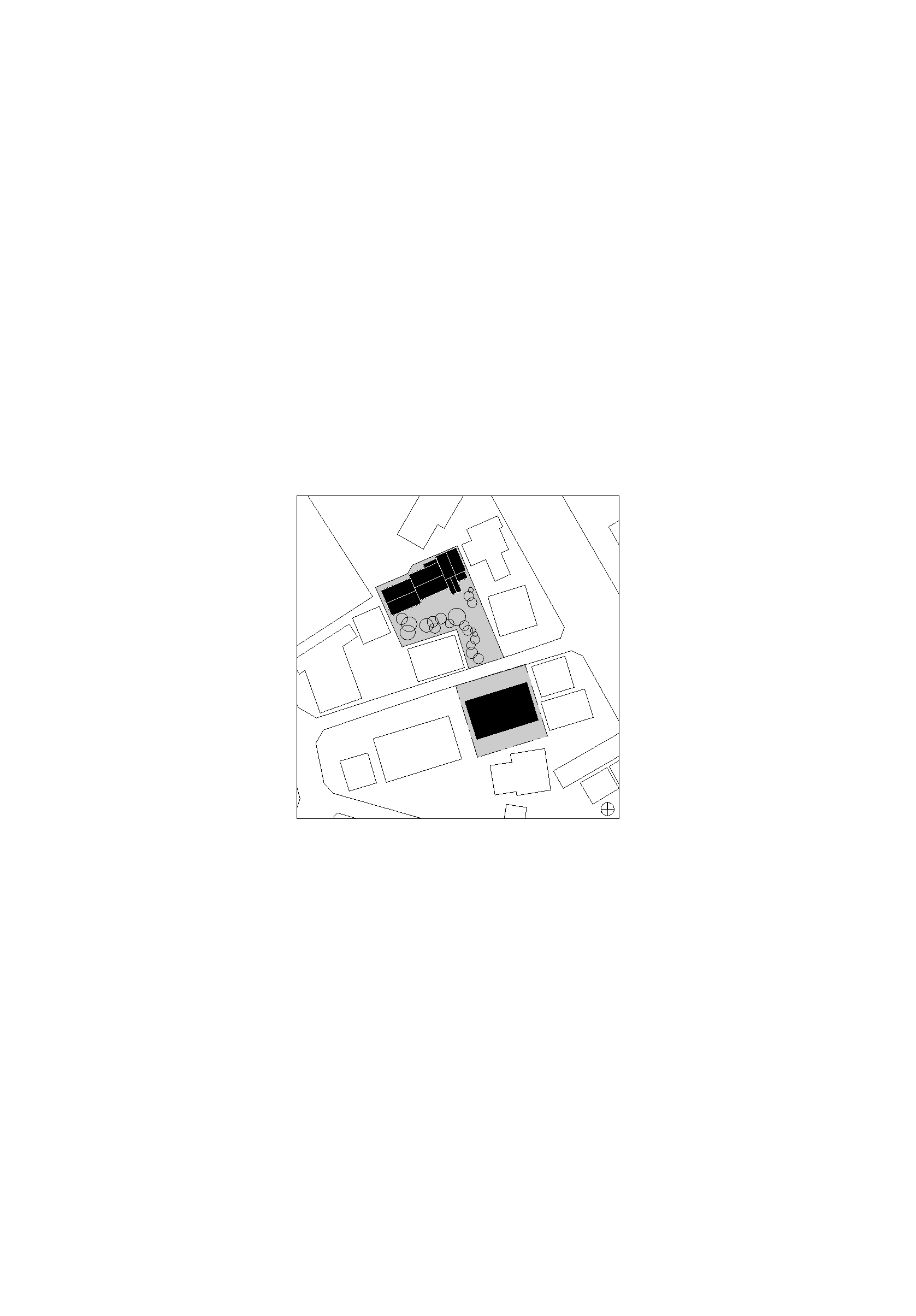 Site plan drawing showing two rectangular building volumes with surrounding street grid and adjacent structures