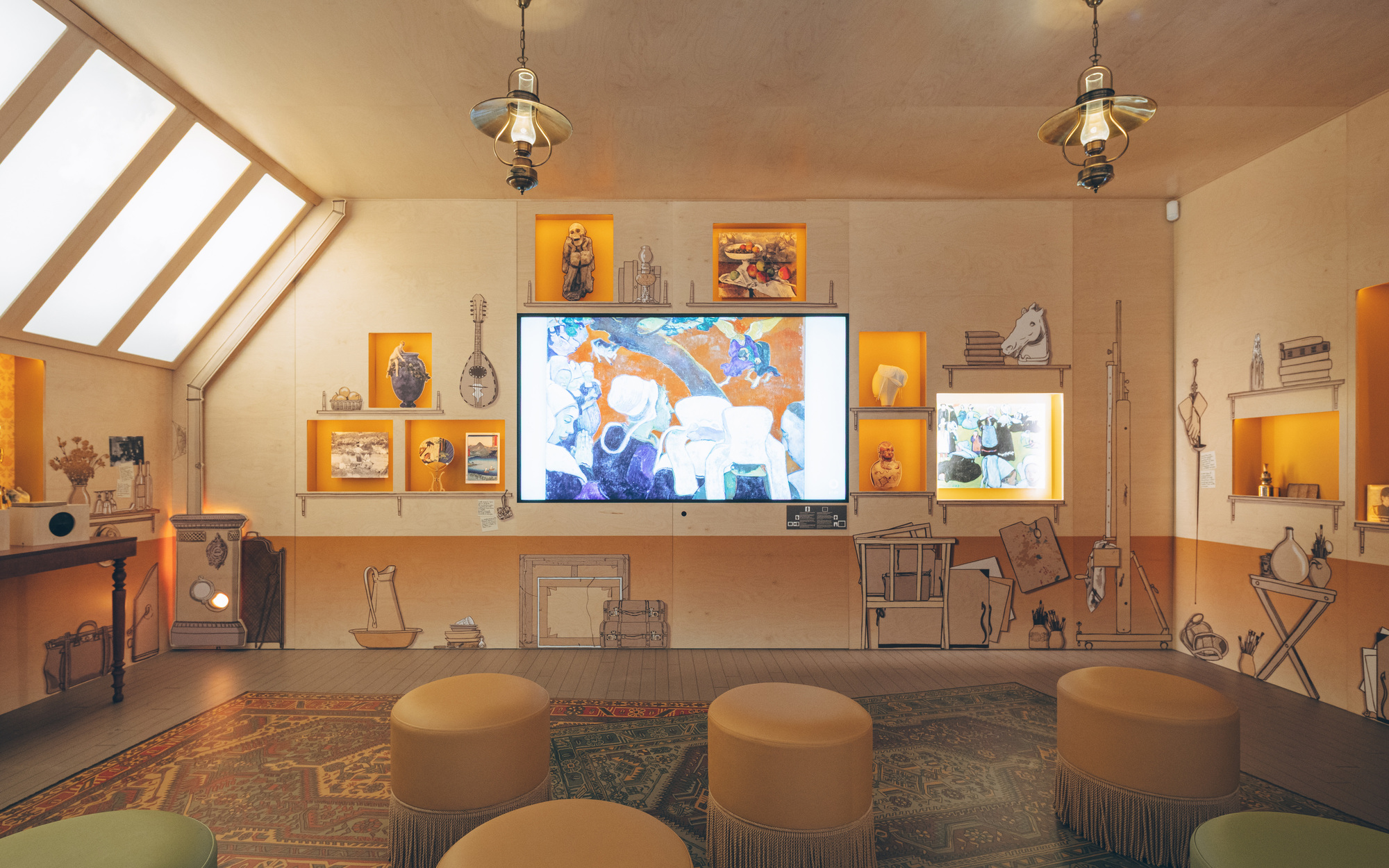 Gallery room with diagonal skylights, illuminated display niches and circular upholstered seating on a patterned rug