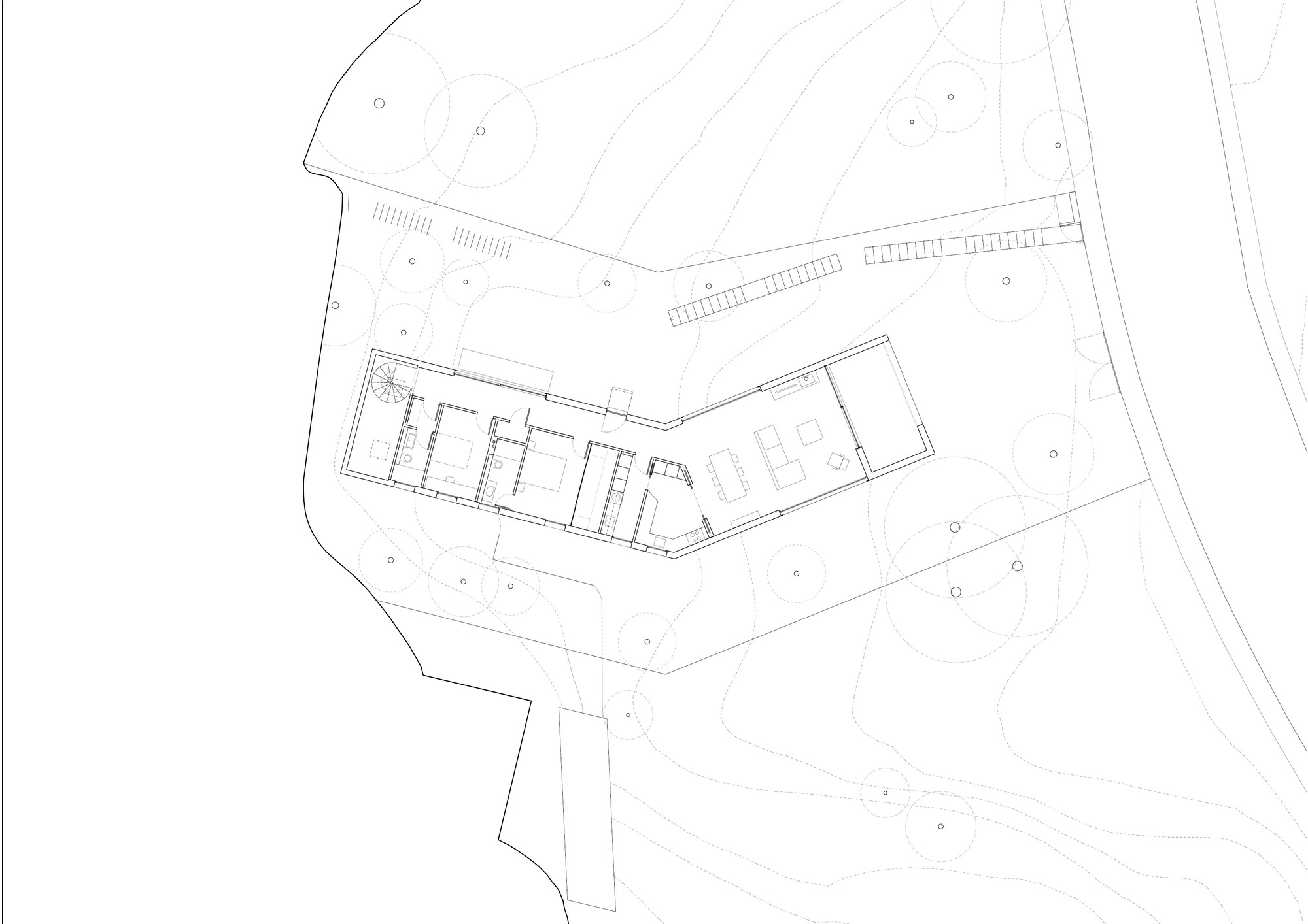 Site plan drawing showing an angled building volume with interior divisions and surrounding landscape contours