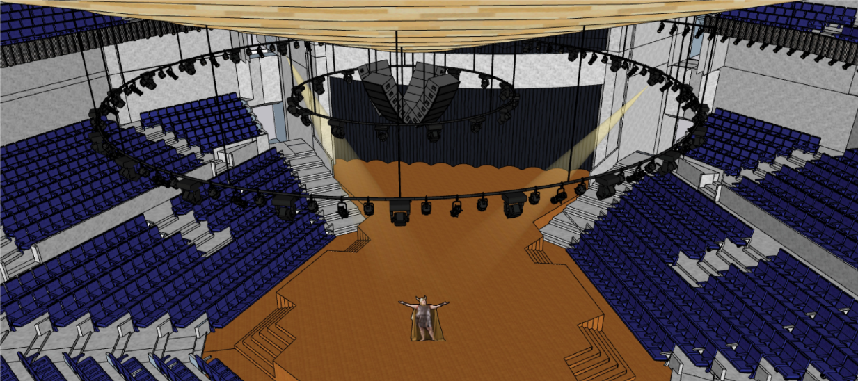 View of tiered blue seating surrounding the central performance floor with suspended acoustic elements and overhead lighting