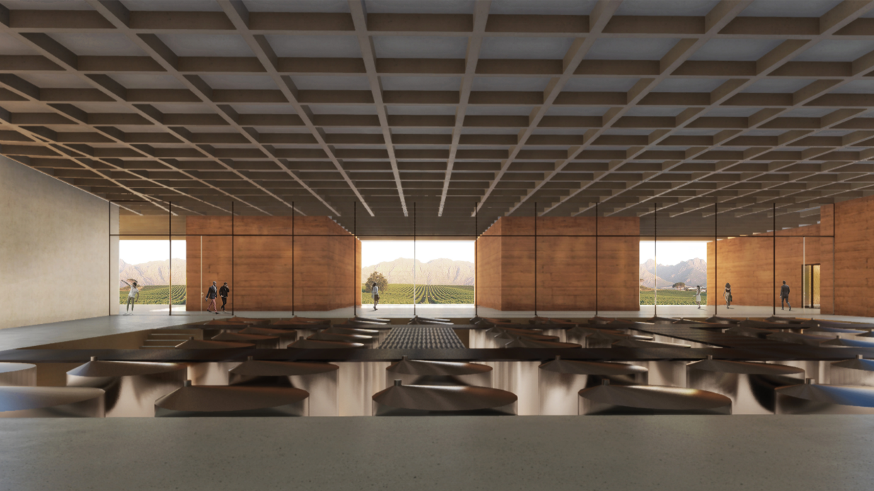 The fermentation hall combines industrial production spaces with panoramic views across the surrounding vineyards.
