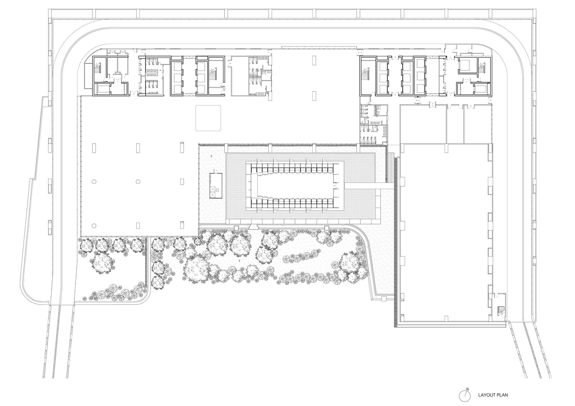 Site plan drawing showing central building with surrounding planted landscape and curved access roads