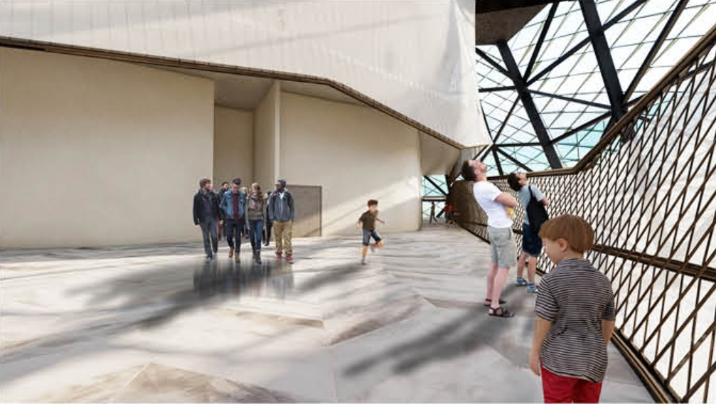 Atrium floor with a faceted stone surface beside a diagonal timber lattice wall, visitors walking through shafts of sunlight. Image: Azadeh K