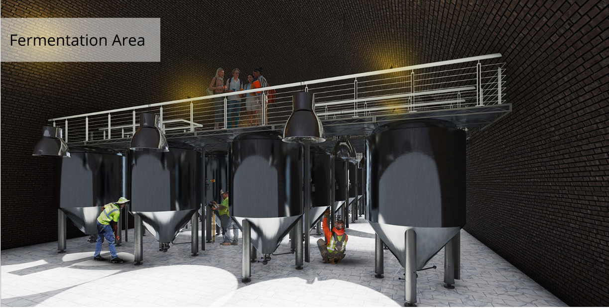 Large fermentation tanks sit beneath an observation walkway, allowing visitors to experience the winemaking process from above.