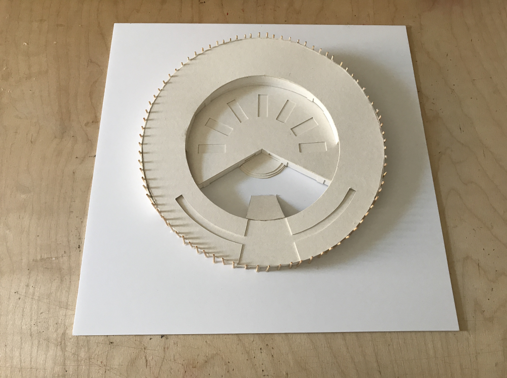 Top view of the kindergarten model highlighting its ring-shaped plan and playful roof access.