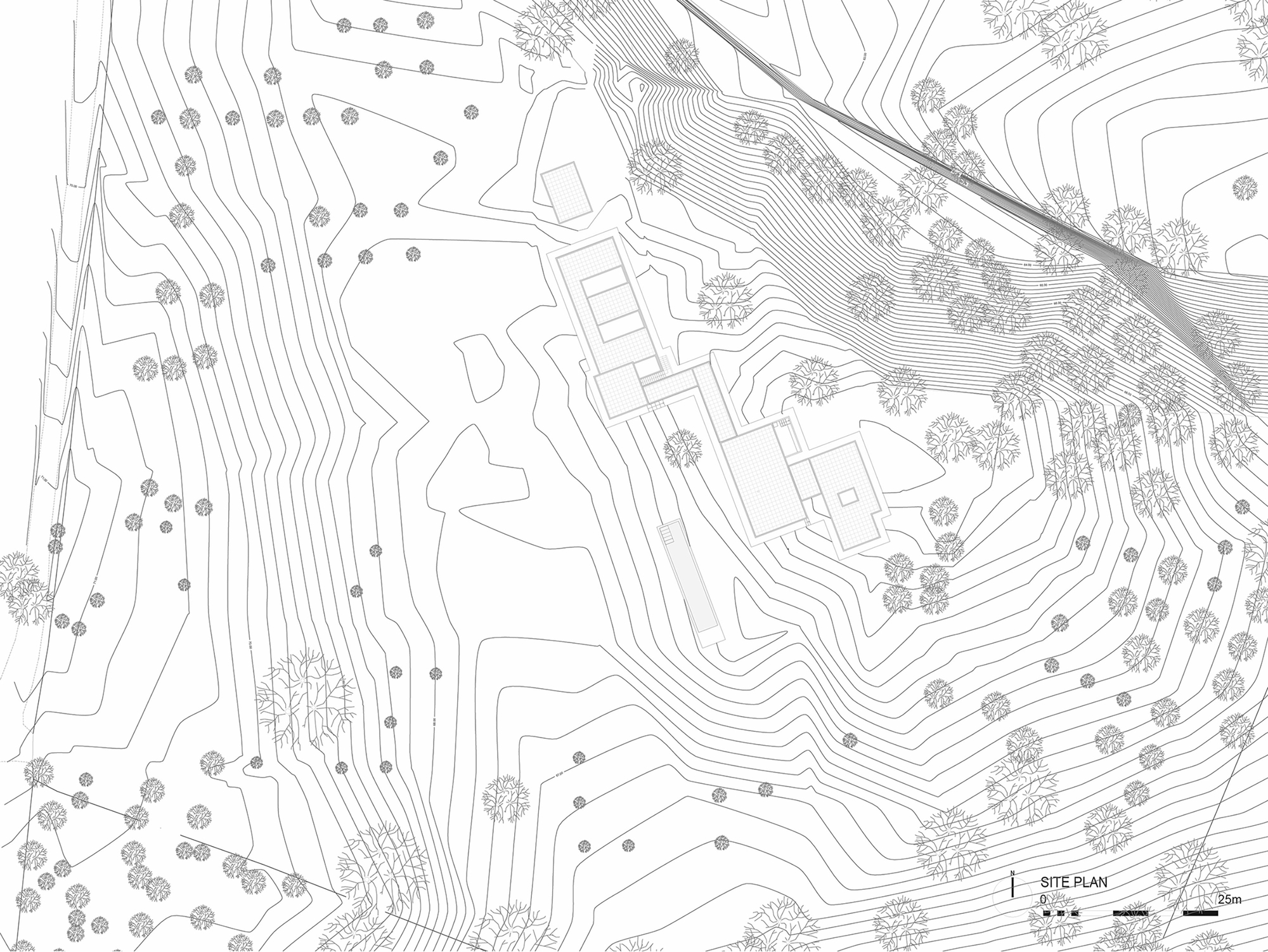 Site plan drawing showing building footprints nestled into contoured hillside terrain with scattered vegetation
