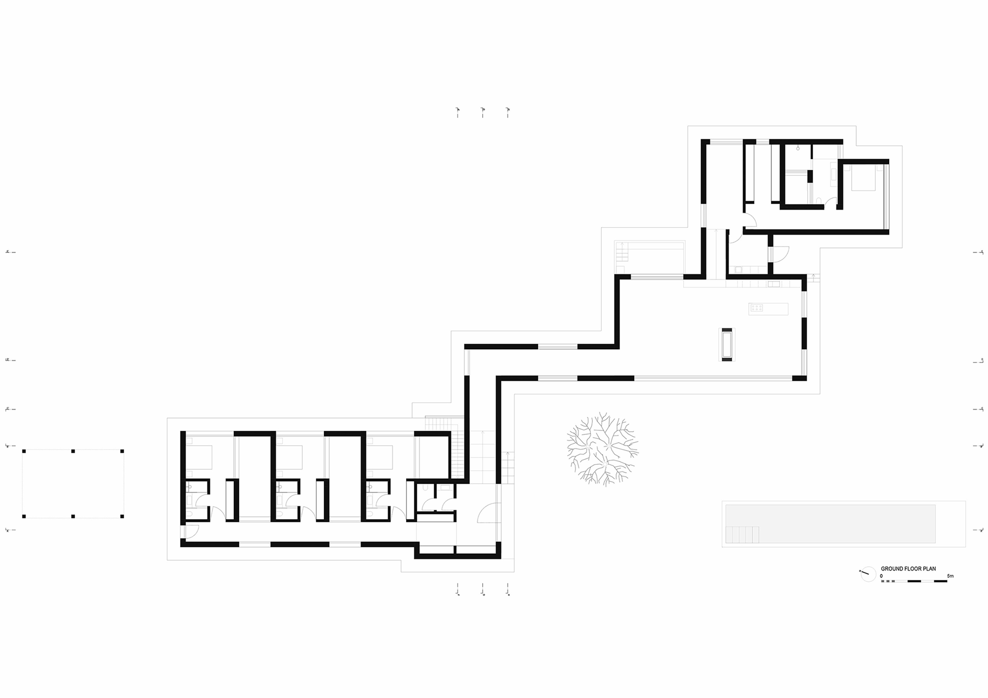 Ground floor plan drawing showing linear arrangement of rooms around a central courtyard with tree