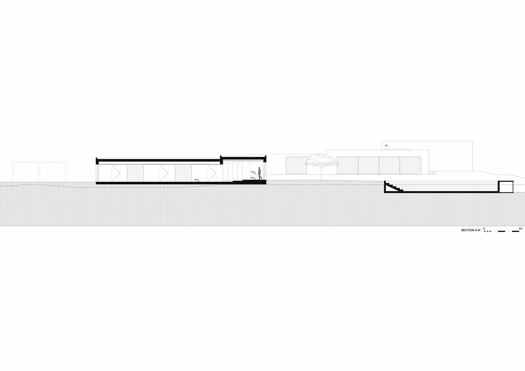 Section drawing showing interconnected volumes with flat and sloped roofs set into sloping terrain