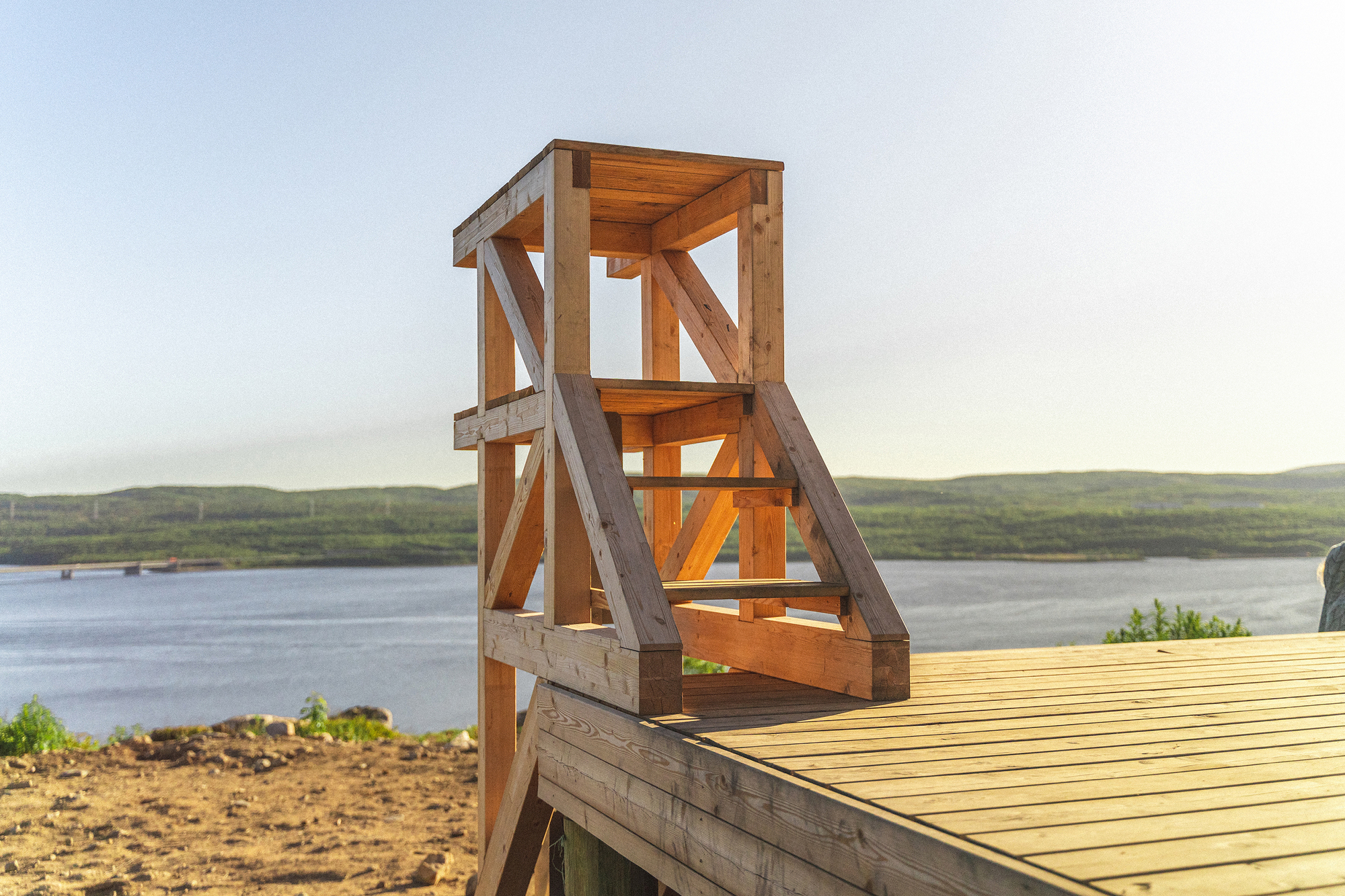 Close-up of the timber stair structure with diagonal bracing and exposed joinery at the deck