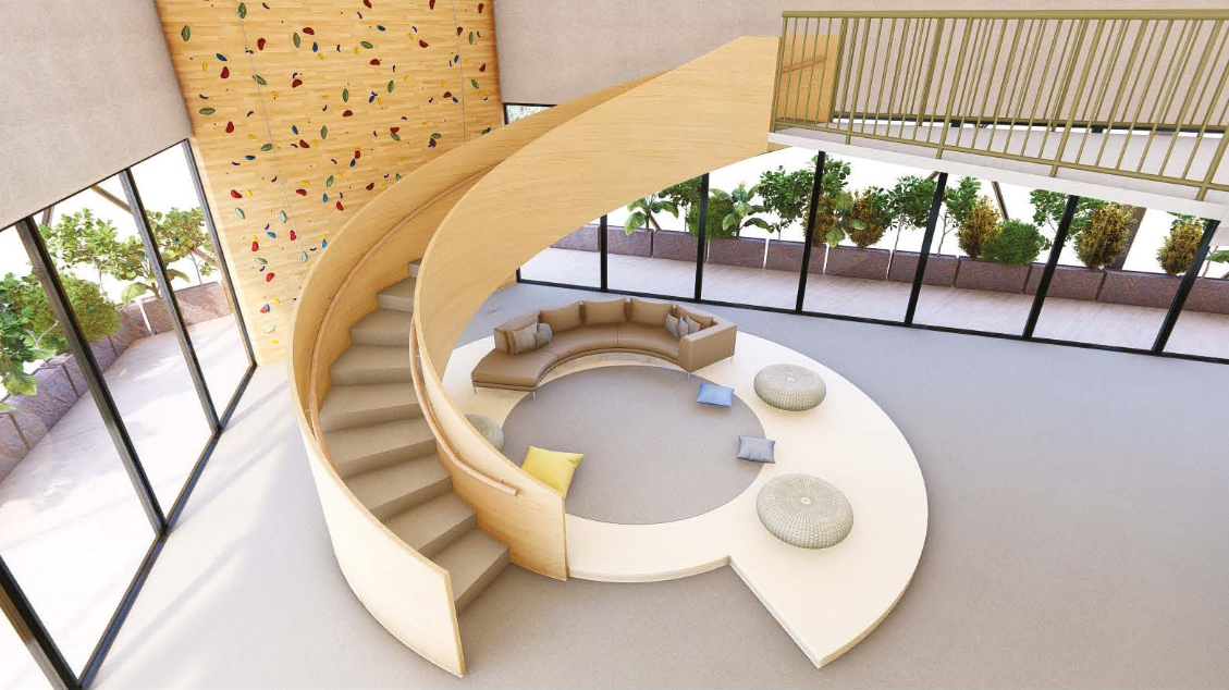 Curved staircases and informal seating transform circulation into a collaborative social space.