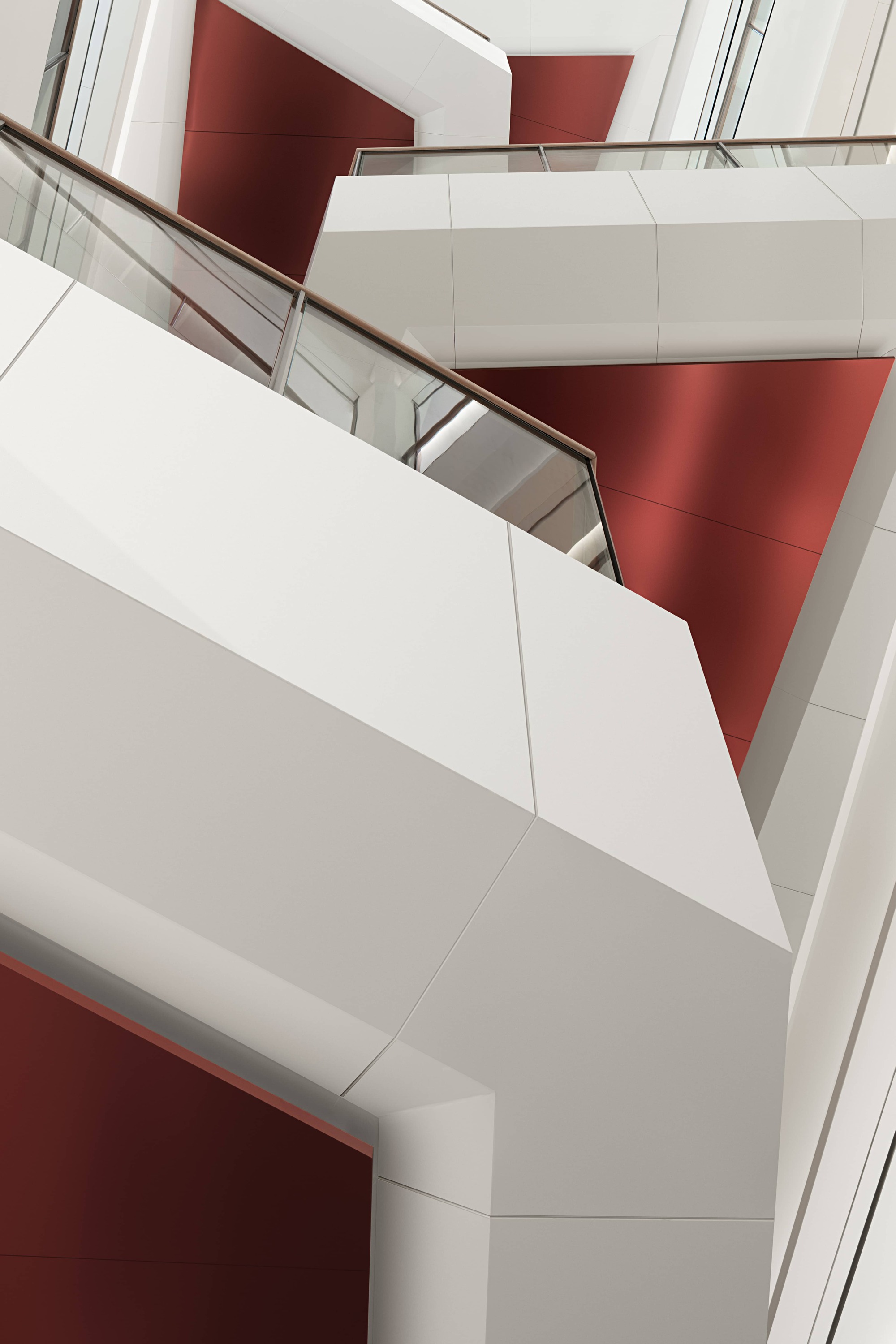 White angular staircase with glass balustrade cutting through red-paneled atrium walls