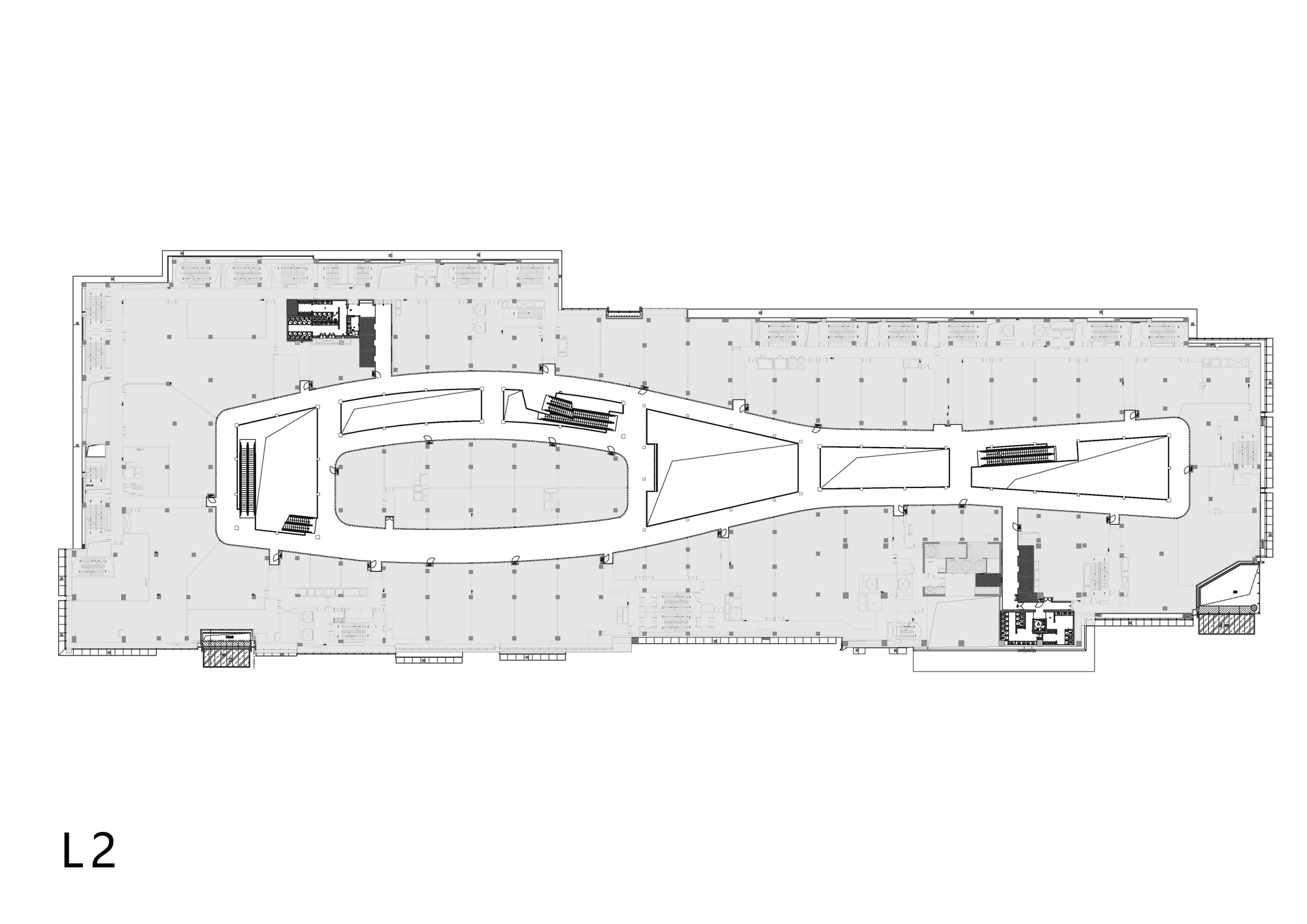 Floor plan drawing showing a tapering central void with flanking rectilinear service cores