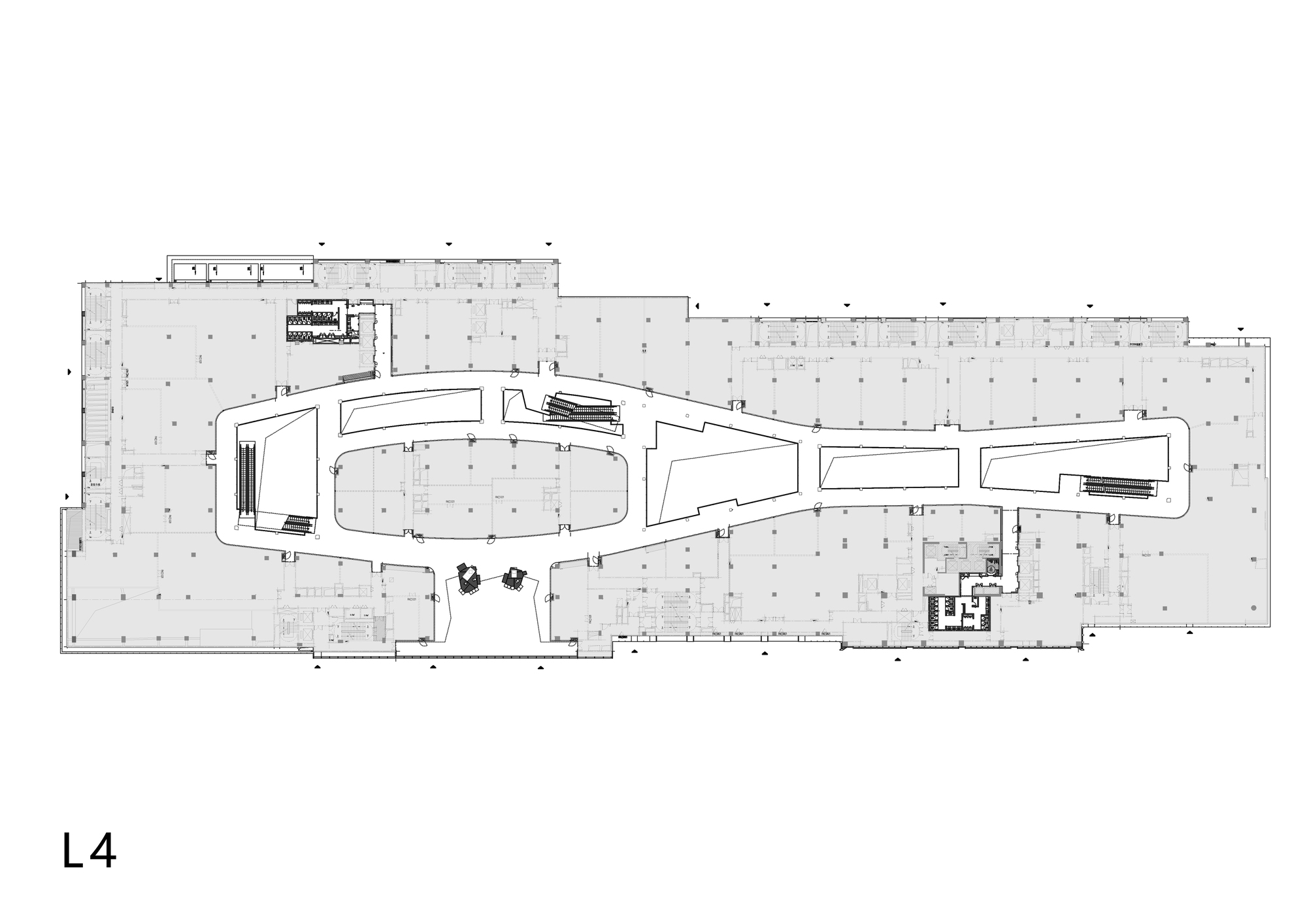 Floor plan drawing showing the same curvilinear volume with central vertical circulation elements