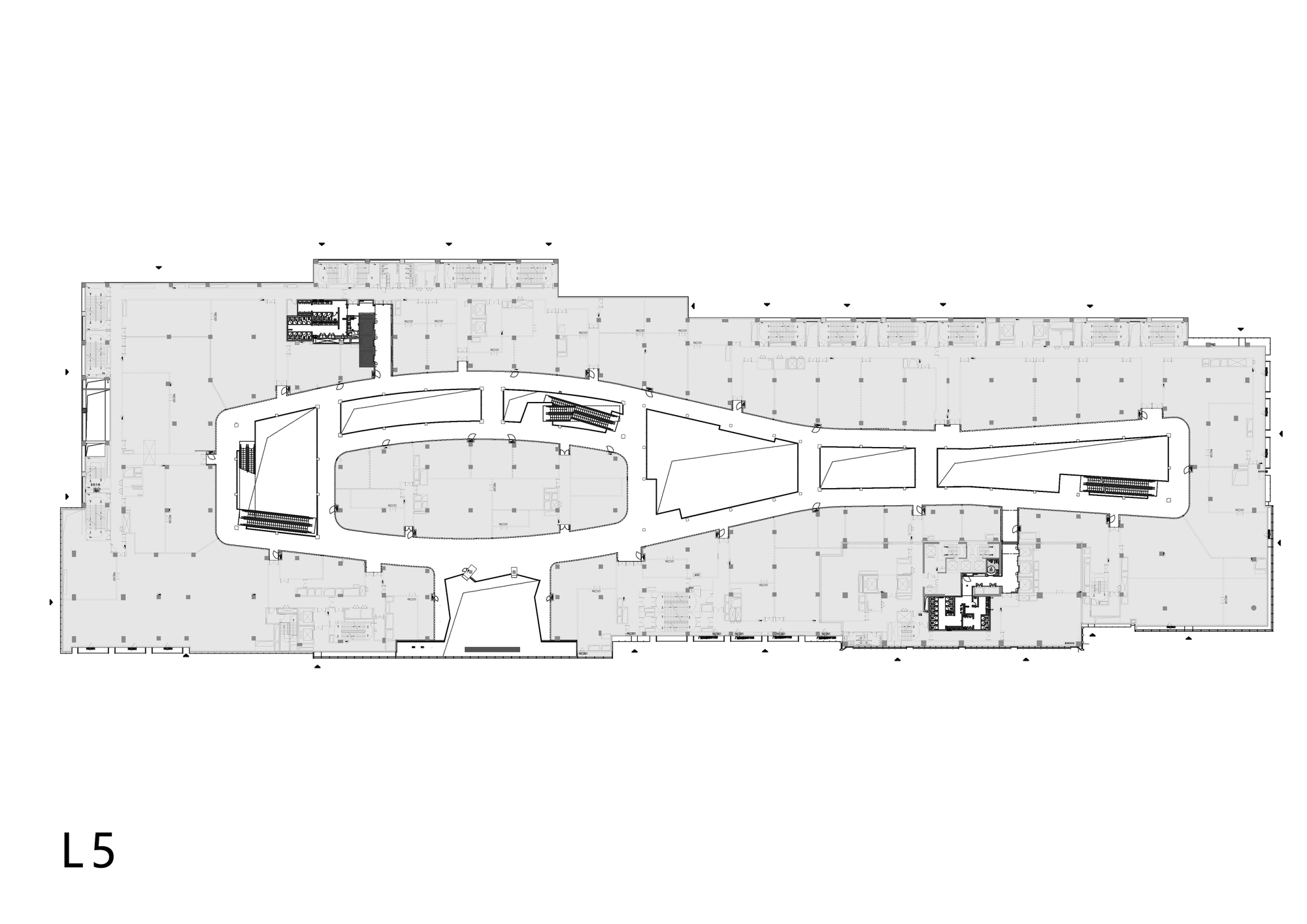 Floor plan drawing showing the elongated volume with lower level entry vestibule and circulation
