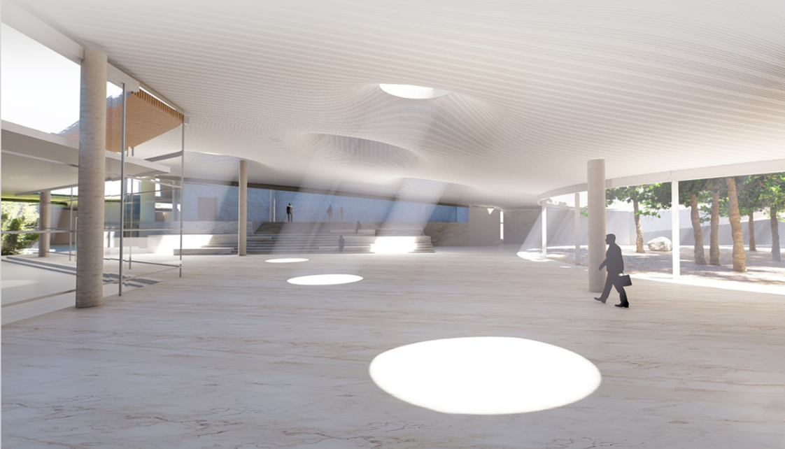 Light-filled performance hall opening toward the surrounding landscape.
